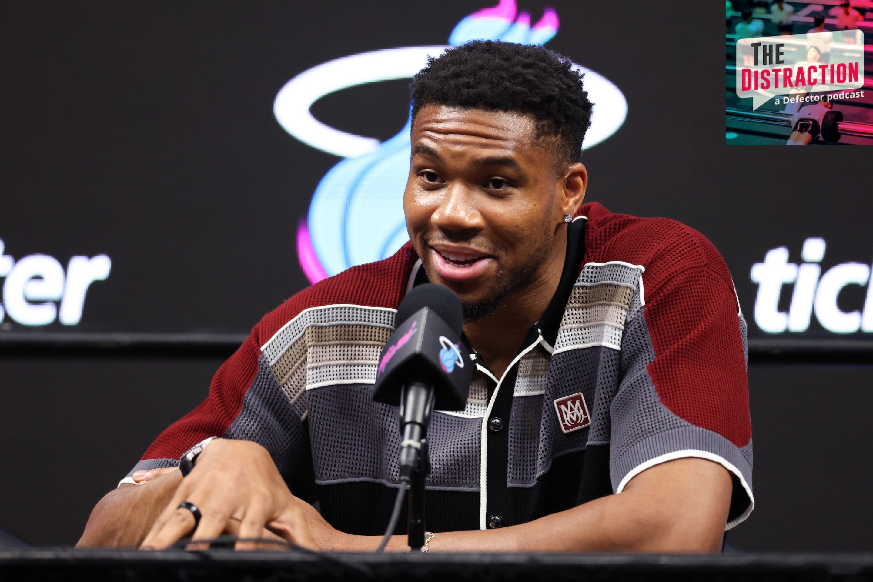 Giannis Antetokounmpo of the Miami Heat speaks to the media during an introductory press conference at Kaseya Center on July 16, 2026. The Distraction logo is at upper right.