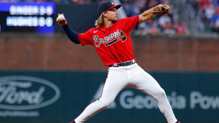 Jim Jarvis #74 of the Atlanta Braves fields and throws to first during the fifth inning against the Texas Rangers at Truist Park on July 17, 2026 in Atlanta, Georgia.