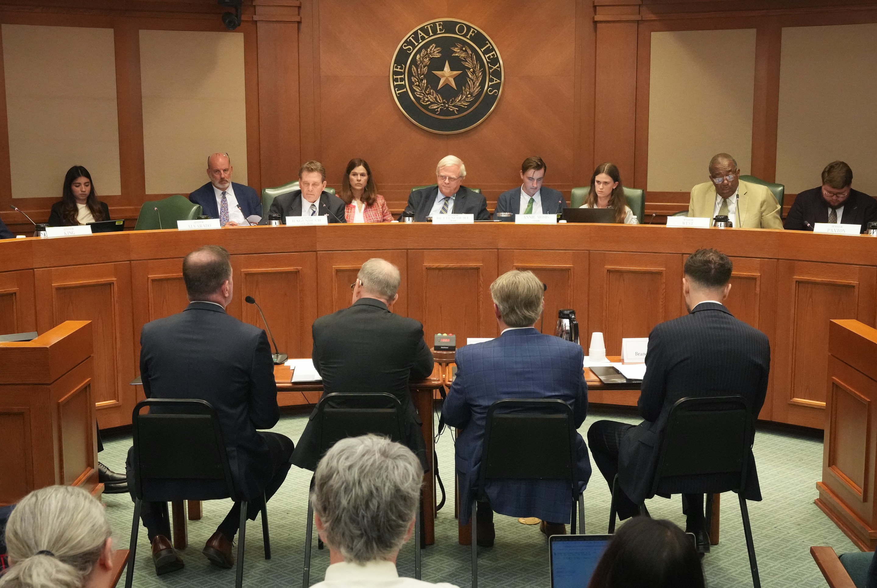 AUSTIN, TEXAS - JULY 28: From left, Brandon Creighton, chancellor of the Texas Tech University System; Wynn Rosser, commissioner of the Texas Higher Education Coordinating Board; Michael Williams, chancellor of the University of North Texas System; and Brandon Simmons, ombudsman for the Texas Higher Education Coordinating Board, testify during a Texas Senate Committee on Higher Education hearing on Senate Bill 37 at the Capitol in Austin, Tuesday, July 28, 2026. (Jay Janner/The Austin American-Statesman via Getty Images)