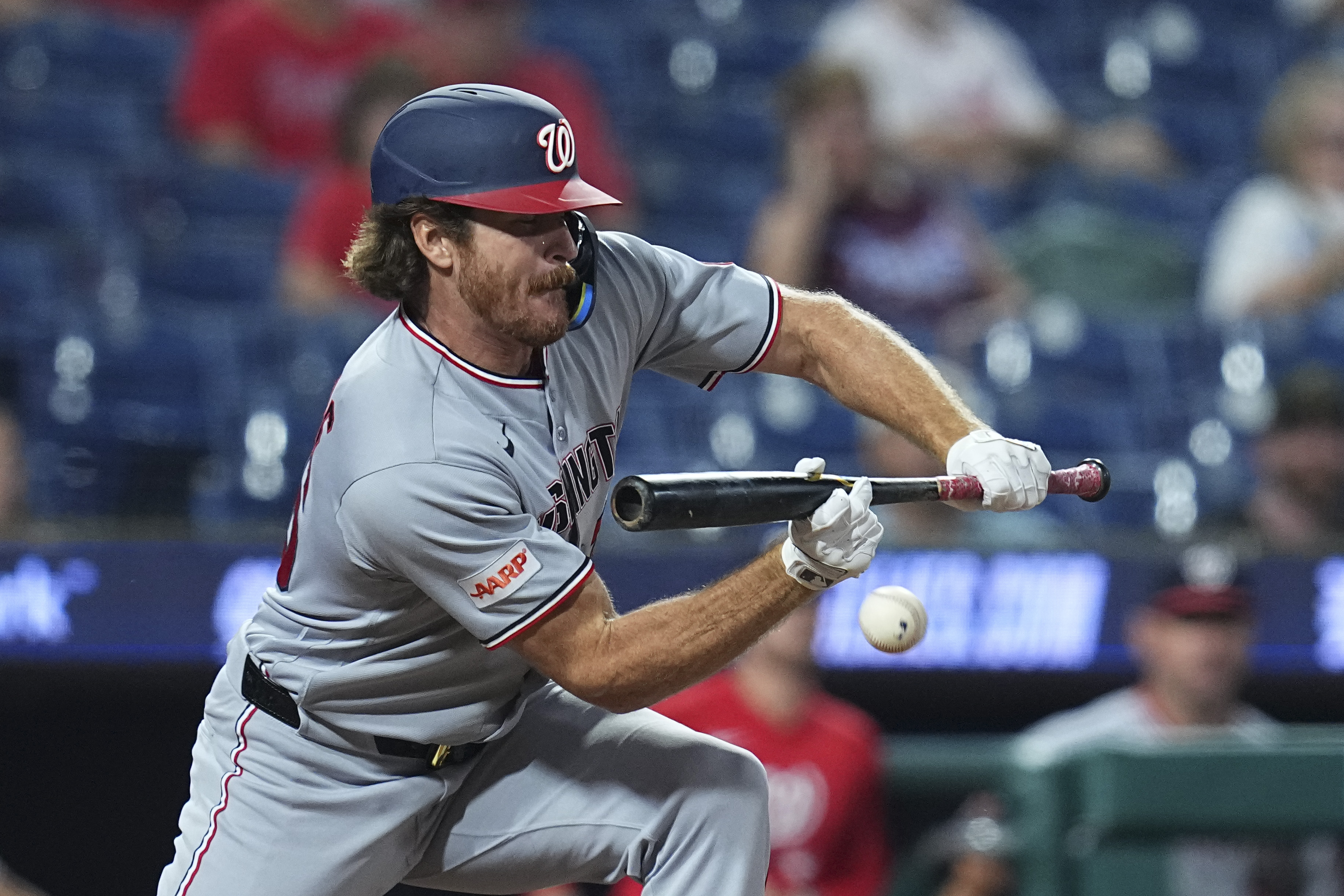 Miles Mikolas #36 of the Washington Nationals lays down a sacrifice RBI bunt in the top of the 11th inning against the Philadelphia Phillies at Citizens Bank Park