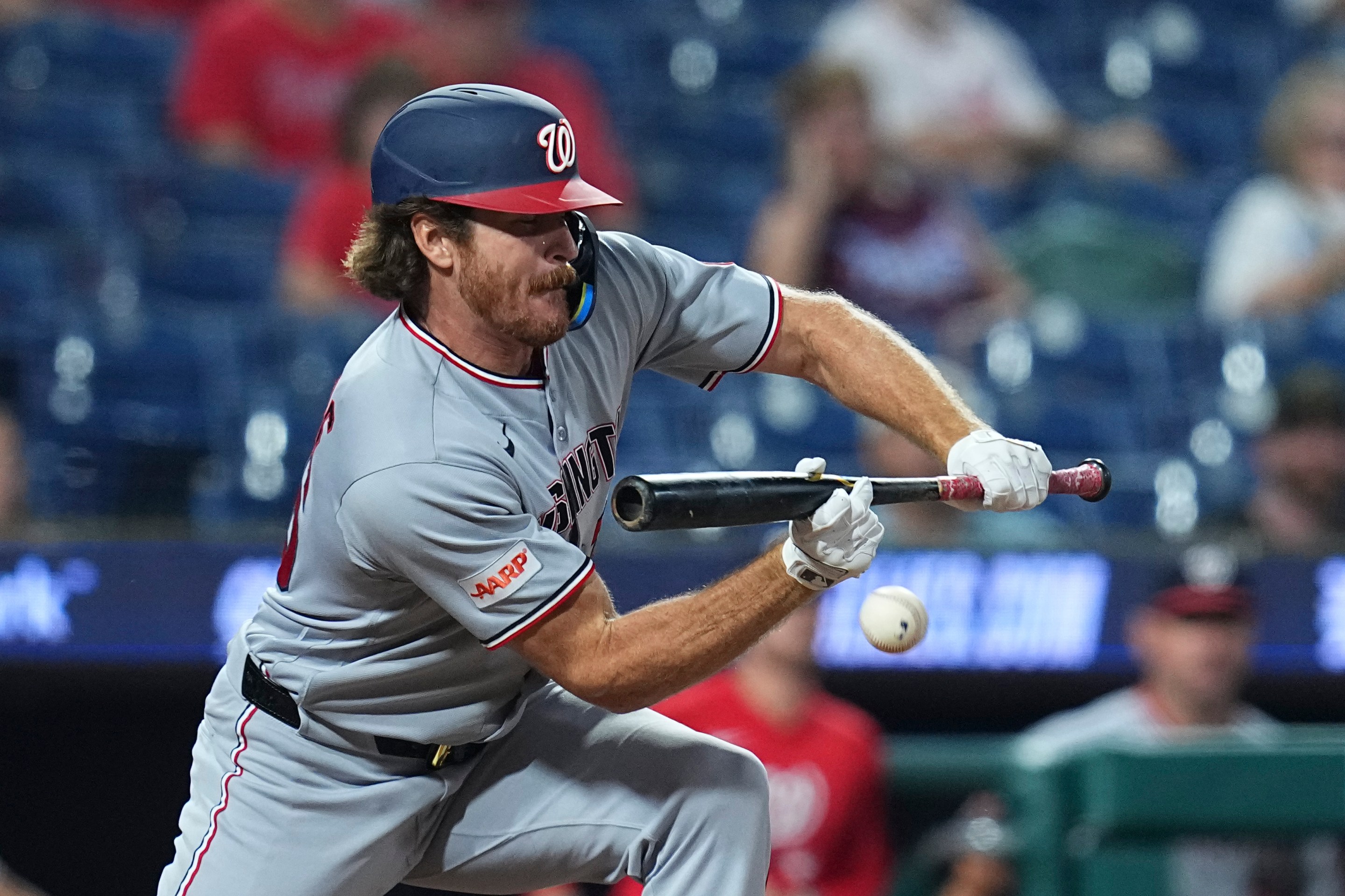 Miles Mikolas #36 of the Washington Nationals lays down a sacrifice RBI bunt in the top of the 11th inning against the Philadelphia Phillies at Citizens Bank Park