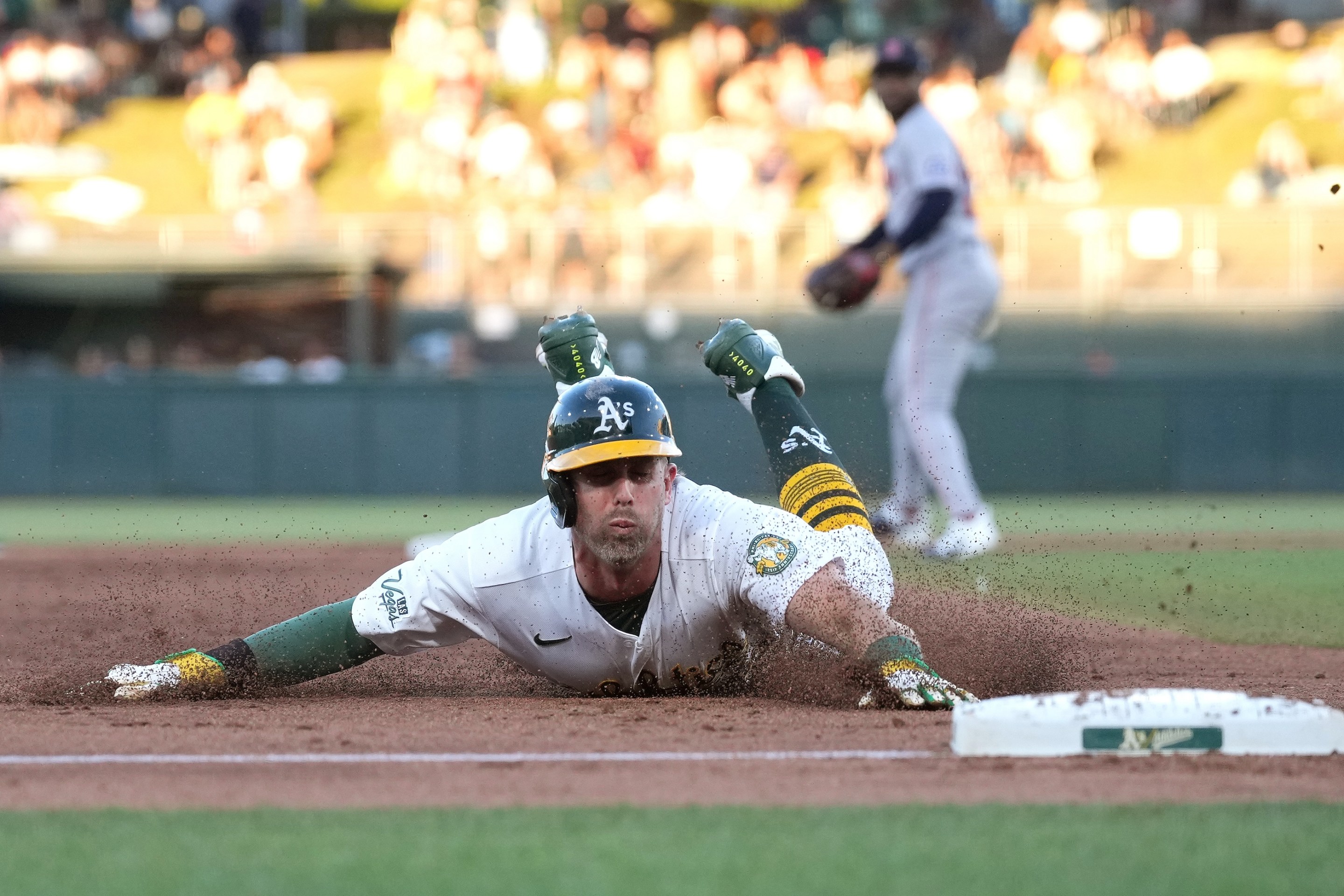 Jeff McNeil of the Athletics slides into third base safe against the Boston Red Sox in the top of the fourth inning of a major league baseball game at Sutter Health Park on July 30, 2026 in Sacramento, California.
