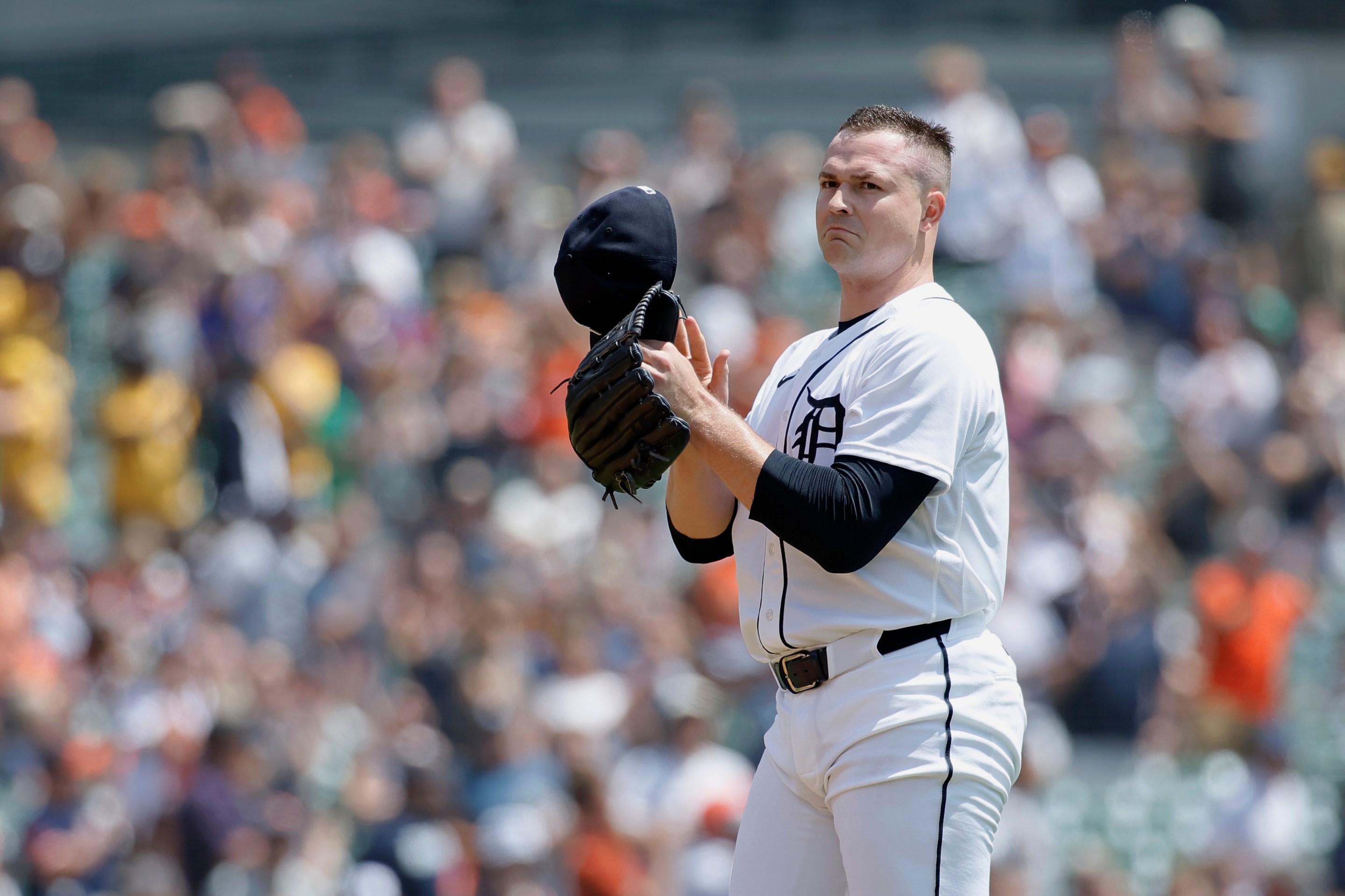 Tarik Skubal #29 of the Detroit Tigers takes off his cap after recording his 1,000th strikeout during the first inning of a game against the Baltimore Orioles at Comerica Park
