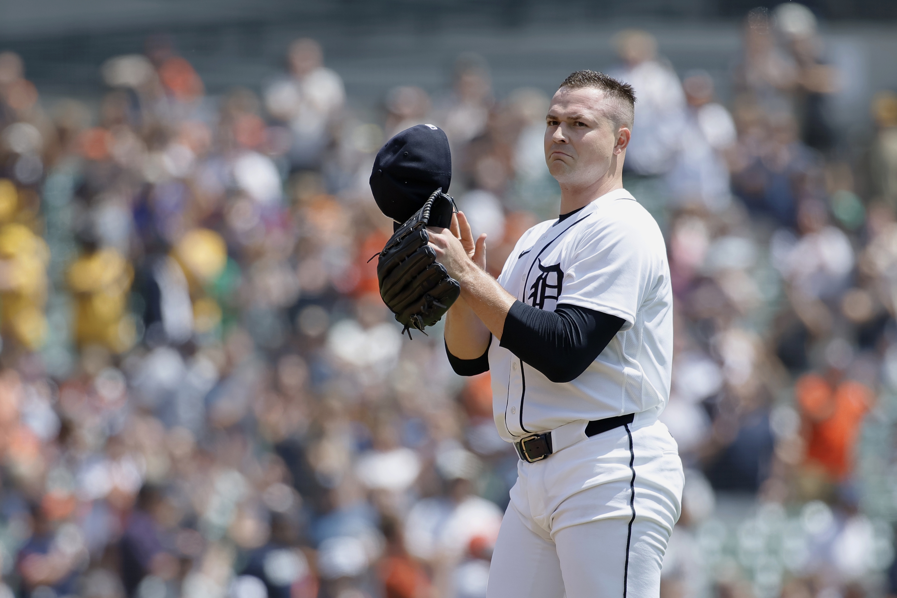 Tarik Skubal #29 of the Detroit Tigers takes off his cap after recording his 1,000th strikeout during the first inning of a game against the Baltimore Orioles at Comerica Park