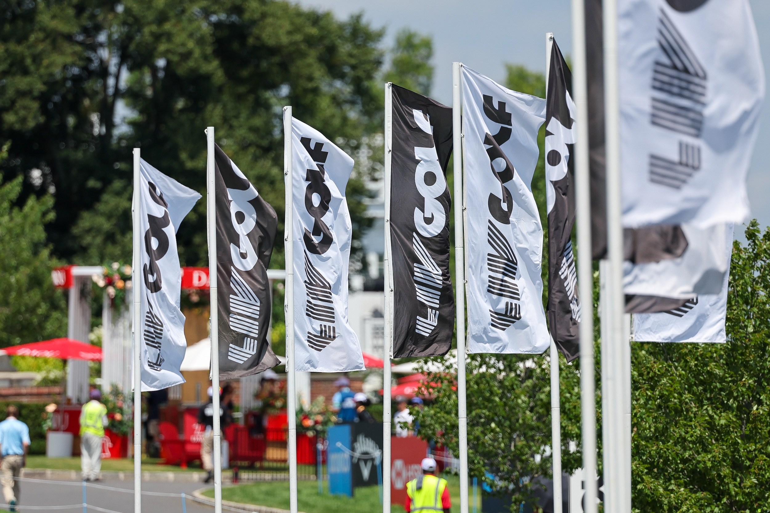 LIV Golf flags blow in the wind in New York.