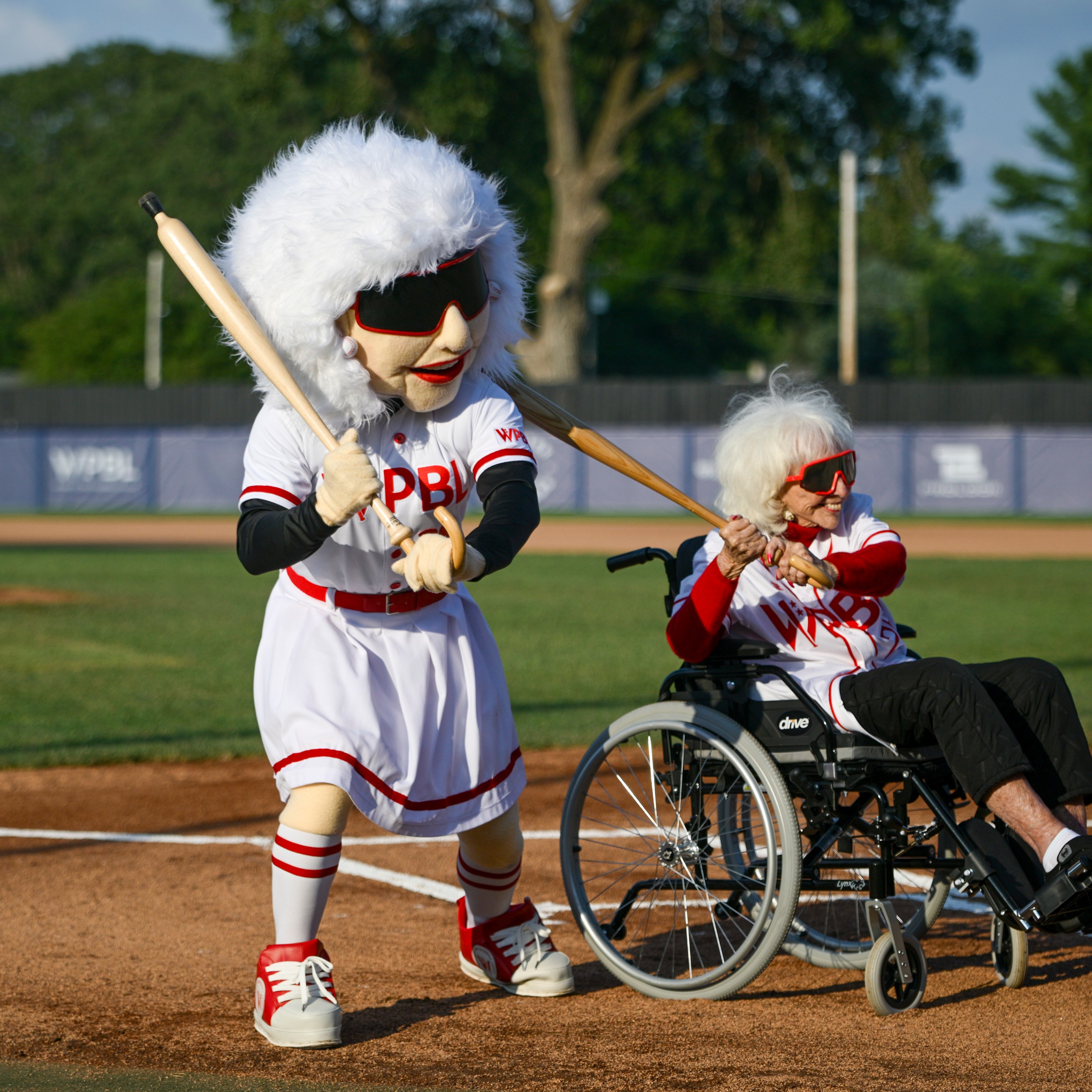 Former All-American Girls Professional Baseball League player Maybelle Blair and WPBL mascot pose for a photo prior to the game between the Boston Hunters and San Francisco Firebells at Robin Roberts Stadium on August 02, 2026 in Springfield, Illinois