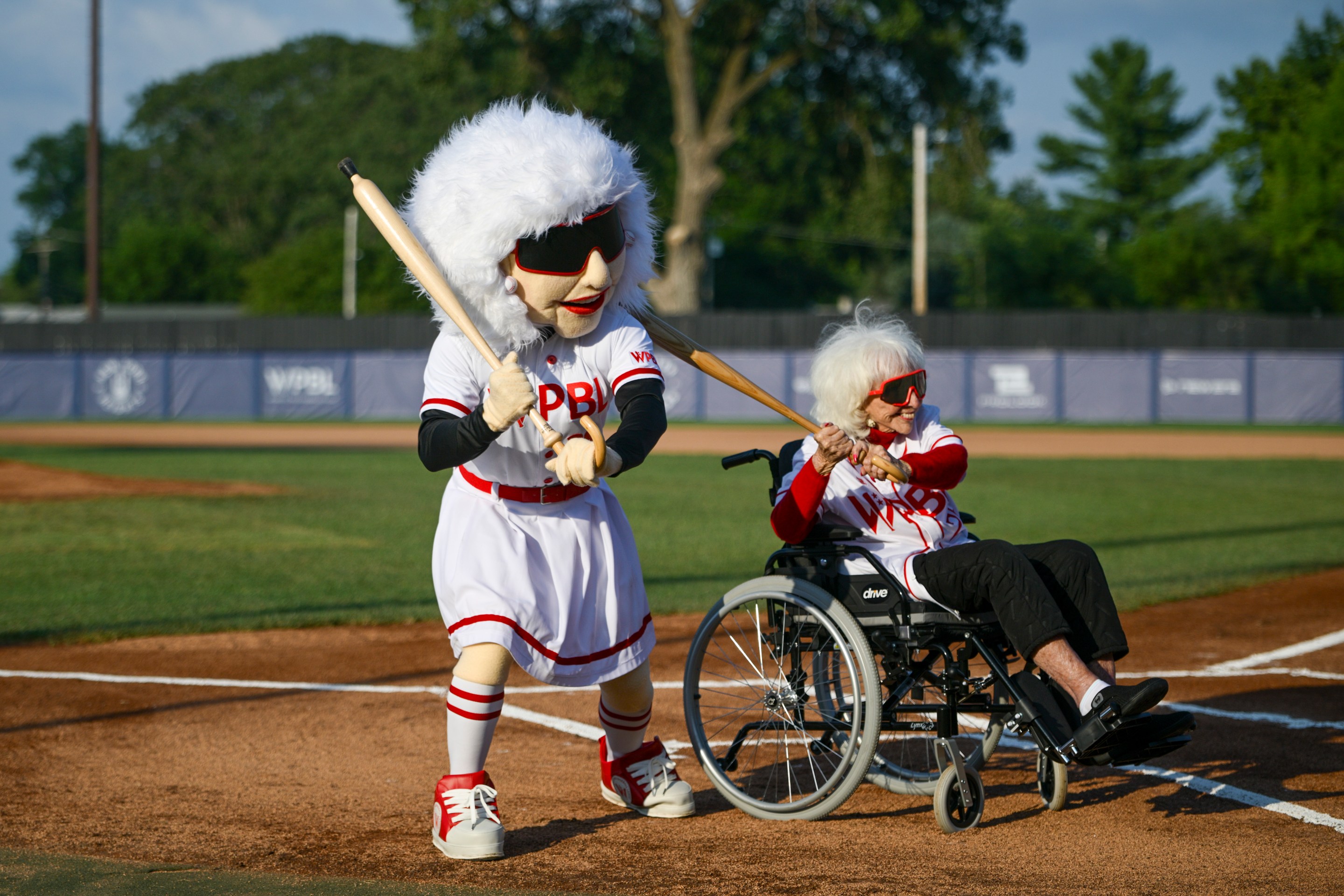 Former All-American Girls Professional Baseball League player Maybelle Blair and WPBL mascot pose for a photo prior to the game between the Boston Hunters and San Francisco Firebells at Robin Roberts Stadium on August 02, 2026 in Springfield, Illinois