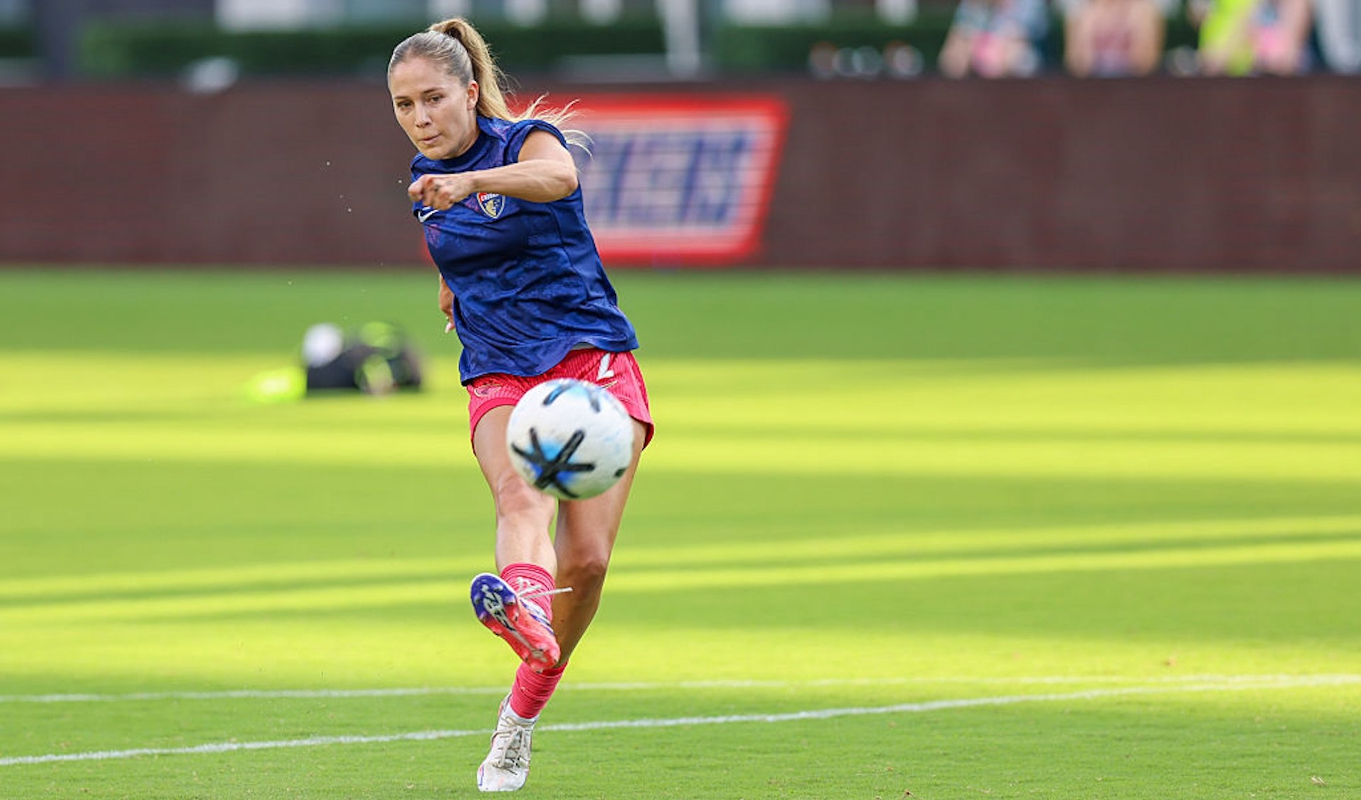 Ashley Sanchez kicks a ball