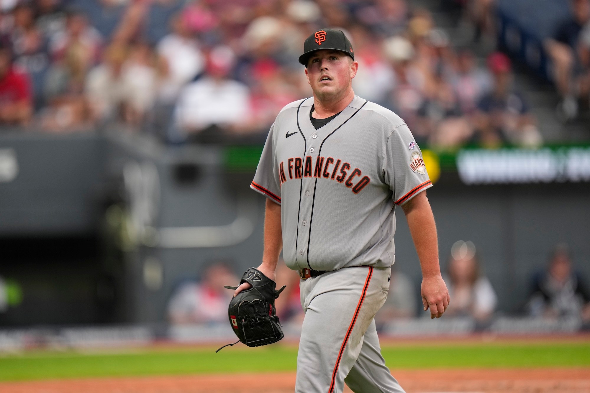 CLEVELAND, OHIO - AUGUST 19: Matt Wilkinson #71 of the San Francisco Giants walks off the field at the end of the inning against the Cleveland Guardians at Progressive Field on August 19, 2026 in Cleveland, Ohio. (Photo by Andy Kuno/San Francisco Giants/Getty Images)