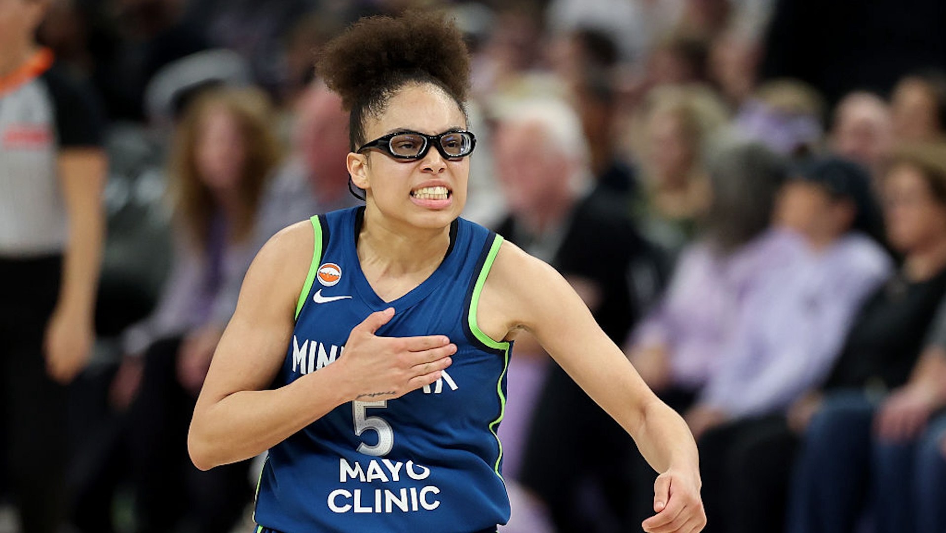 Olivia Miles celebrates after making a shot