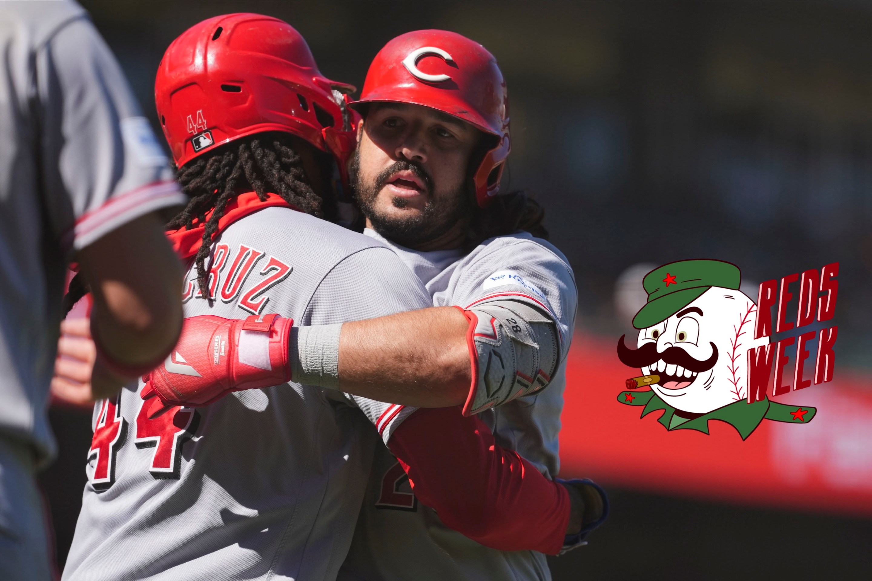 Eugenio Suarez of the Cincinnati Reds hugs teammate Elly de la Cruz #44 after hitting a grand slam home run in the ninth inning during the game between the Cincinnati Reds and the San Francisco Giants at Oracle Park on Wednesday, August 26, 2026.