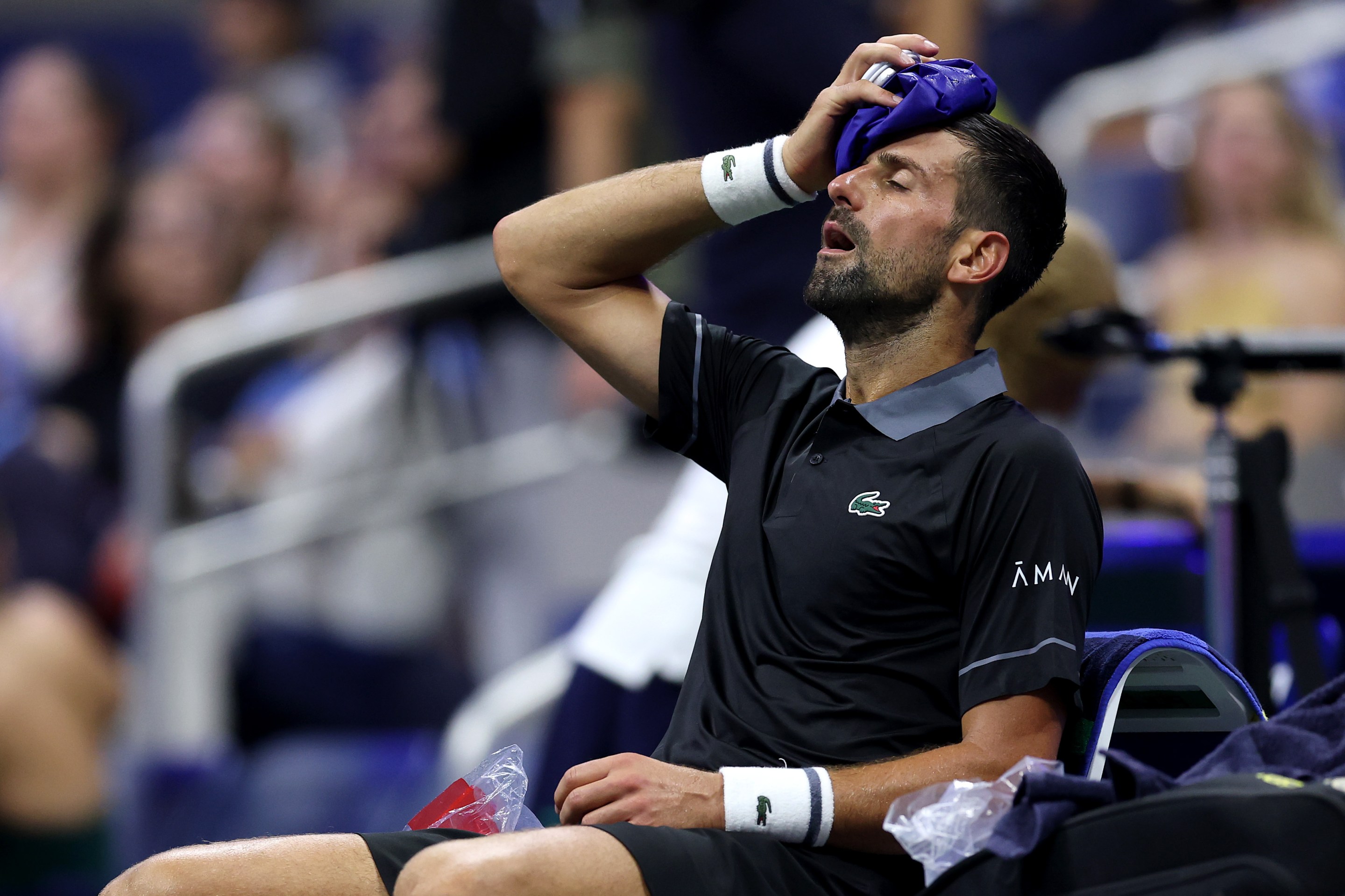 Novak Djokovic of Serbia reacts during a changeover against Mariano Navone