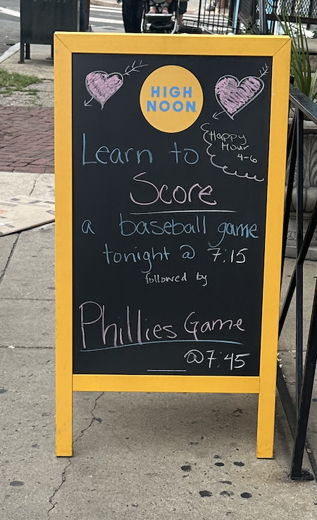 a chalkboard sign advertising my scoring class