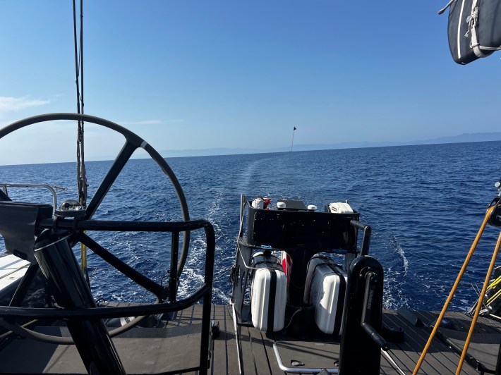 A view of the back of the boat, showing Sisi's starboard wheel and the mini-bar.