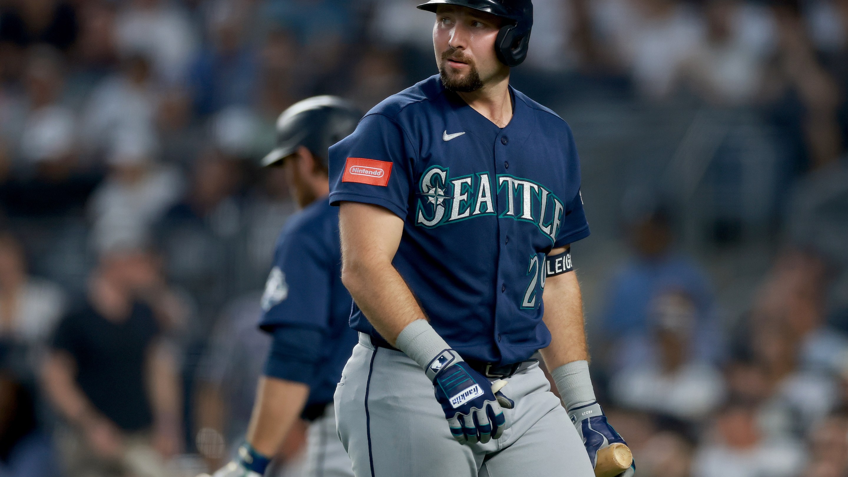 Cal Raleigh #29 of the Seattle Mariners heads back to the dugout after striking out in the second inning against the New York Yankees.