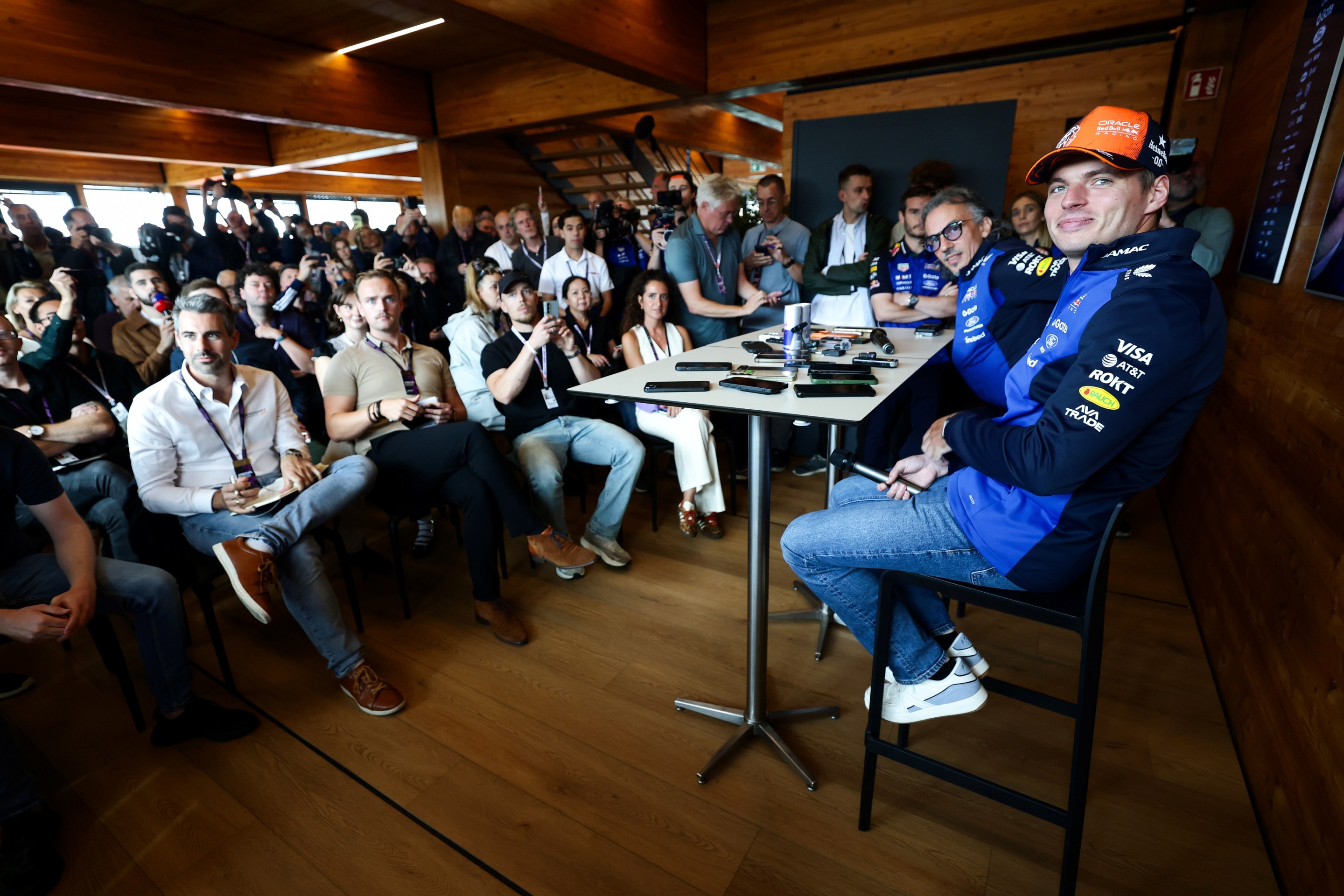 Max Verstappen of the Netherlands and Oracle Red Bull Racing and Laurent Mekies, Team Principal of Oracle Red Bull Racing pose for a photo in a press conference.