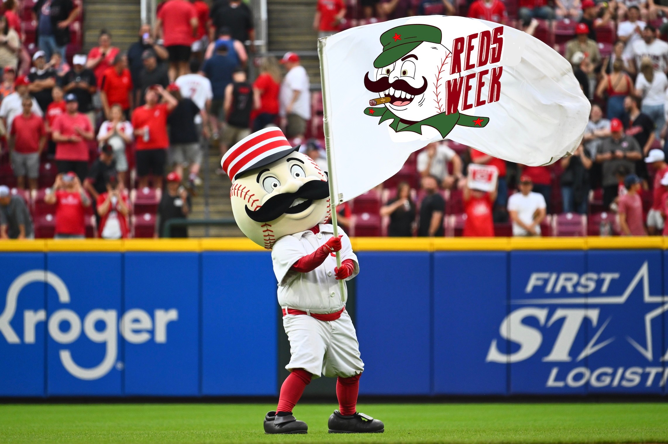 Mr Redlegs waves a Comrade Redlegs flag.