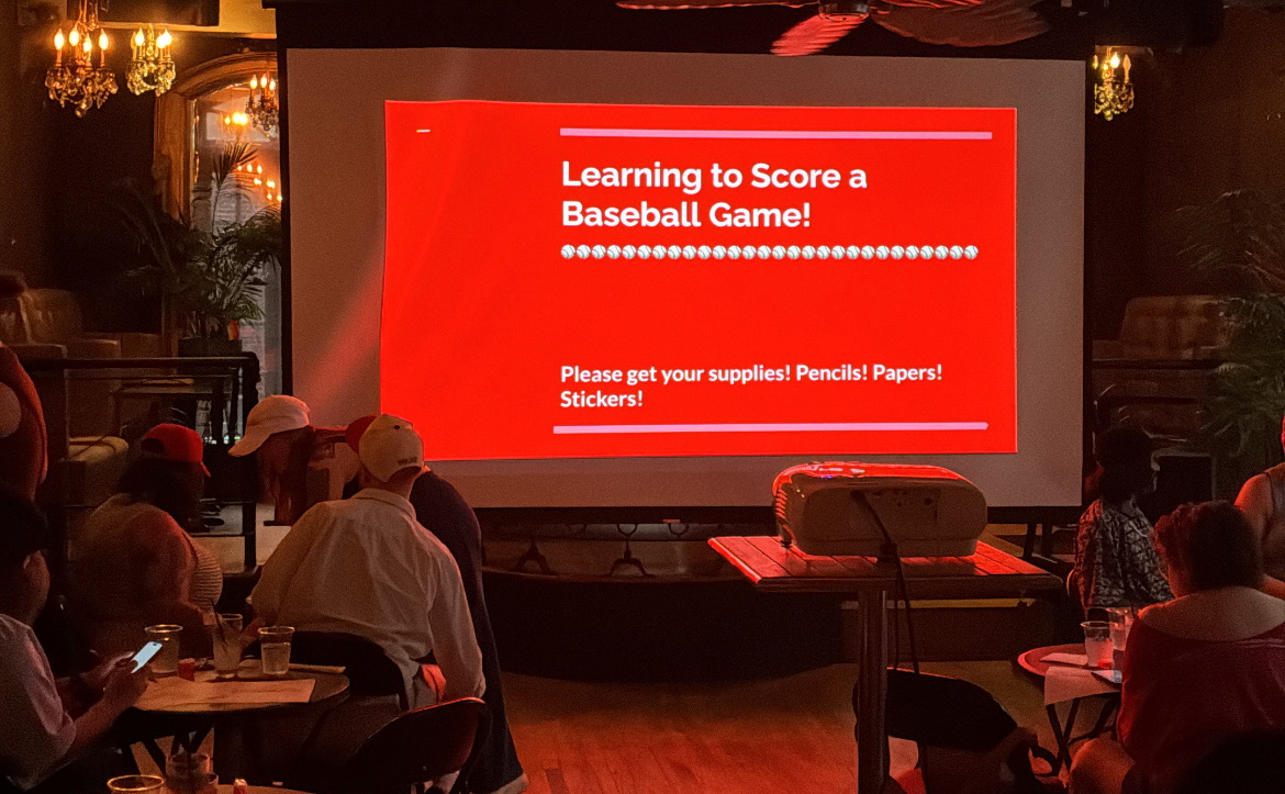 slideshow showing "learning to score a baseball game" in a bar