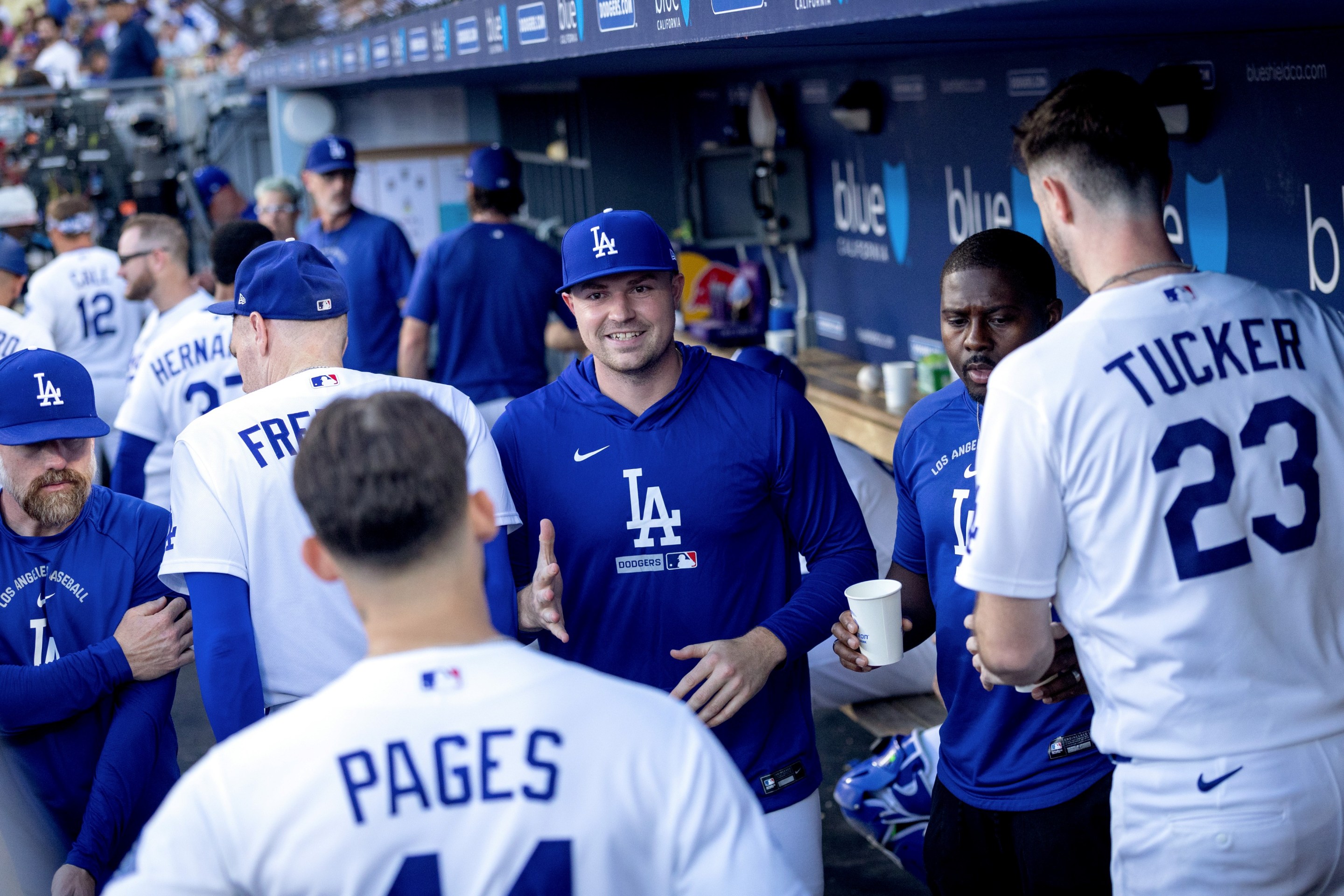 Los Angeles Dodgers pitcher Tarik Skubal greets teammate center fielder Andy Pages (44) during the eighth inning of an MLB game against the Boston Red Sox.