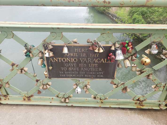 the plaque and the bells on the bridge