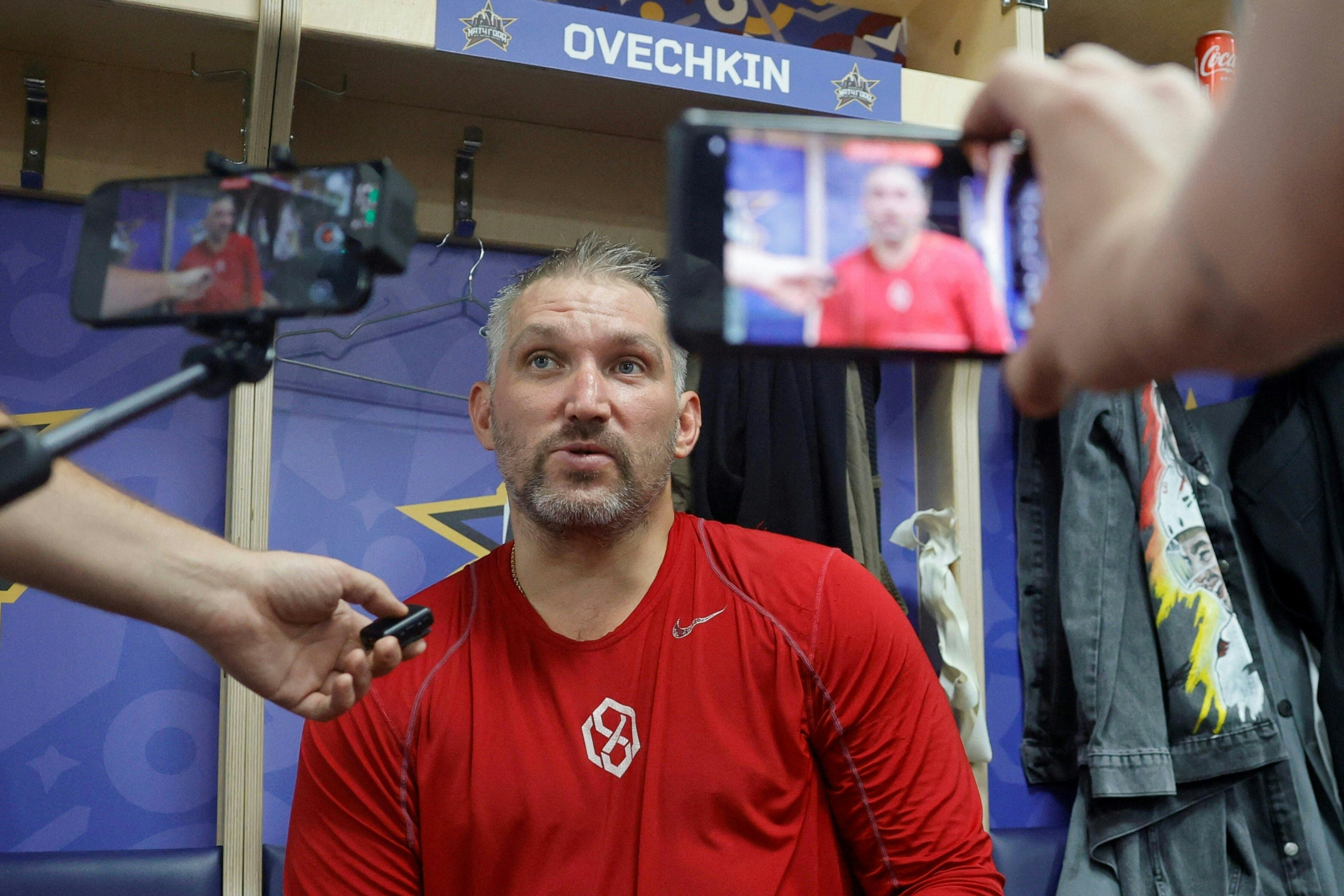 Russian Alexander Ovechkin talks to media in a locker room after the charity hockey "Match of the Year" between Russian players of the National Hockey League (NHL) and the Kontinental Hockey League (KHL) at the CSKA arena in Moscow on July 13, 2025. (Photo by TATYANA MAKEYEVA / AFP via Getty Images)