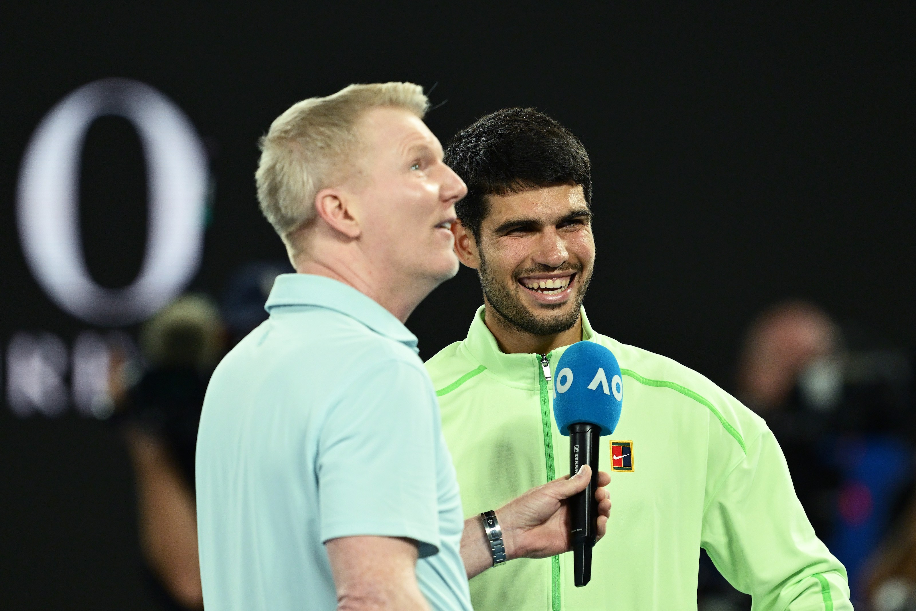 Carlos Alcaraz of Spain is interviewed by Jim Courier following victory over Alex de Minaur of Australia during the Men's Singles Quarter Final match on day 10 of the 2026 Australian Open at Melbourne Park on January 27, 2026 in Melbourne, Australia. (Photo by Quinn Rooney/Getty Images)