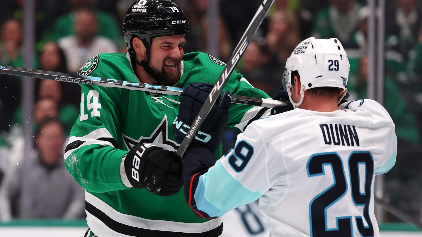 DALLAS, TEXAS - FEBRUARY 25: Jamie Benn #14 of the Dallas Stars and Vince Dunn #29 of the Seattle Kraken grapple during the third period at American Airlines Center on February 25, 2026 in Dallas, Texas.