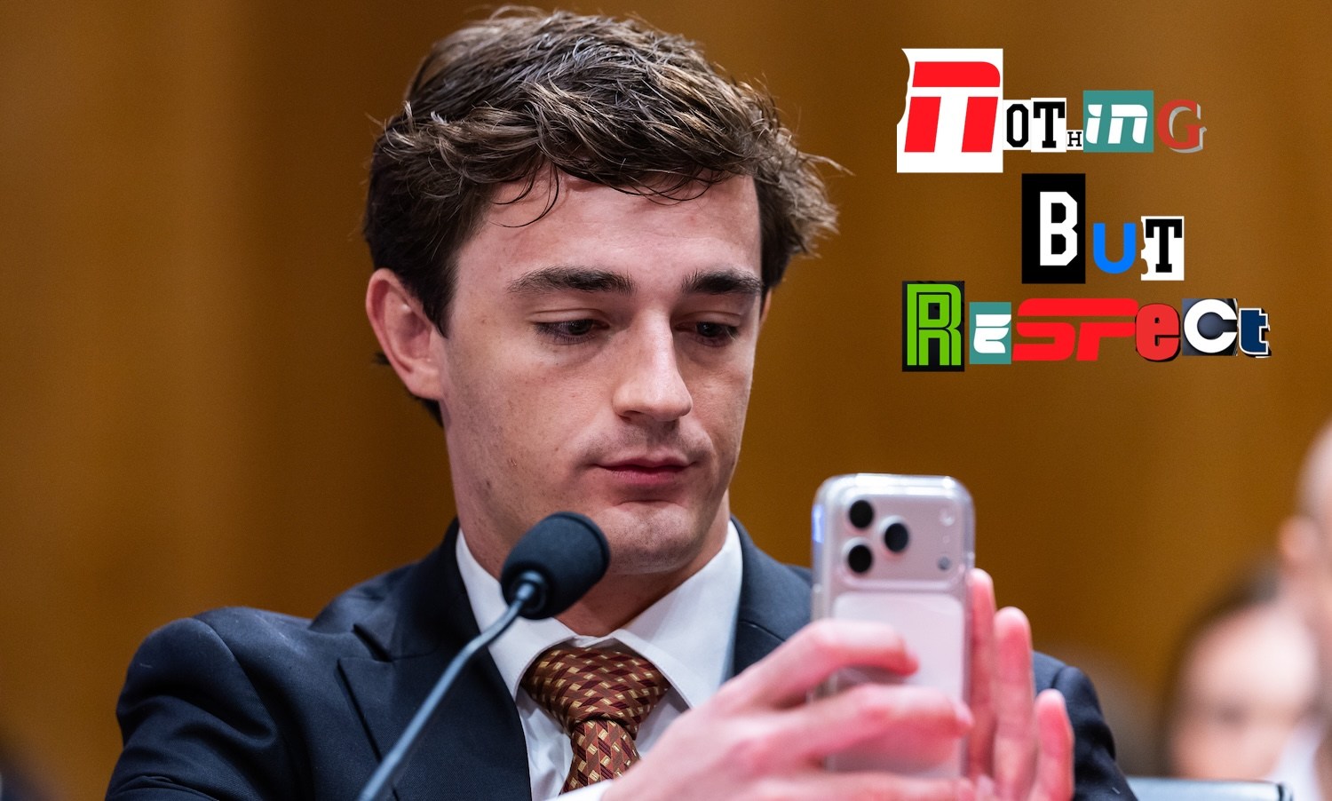 WASHINGTON, DC - JULY 15: Conservative YouTuber and influencer Nick Shirley records during a Senate Homeland Security and Governmental Affairs Committee hearing on exposing fraud in Dirksen Senate Office Building on July 15, 2026 in Washington, DC. CEO of O’Keefe Media Group James O'Keefe and Acting Vice-President of Policy and Government Affairs at the Project On Government Oversight (POGO) Dylan Hedtler-Gaudette also testified about various fraud schemes uncovered across the U.S. (Photo by Finn Gomez/Getty Images)