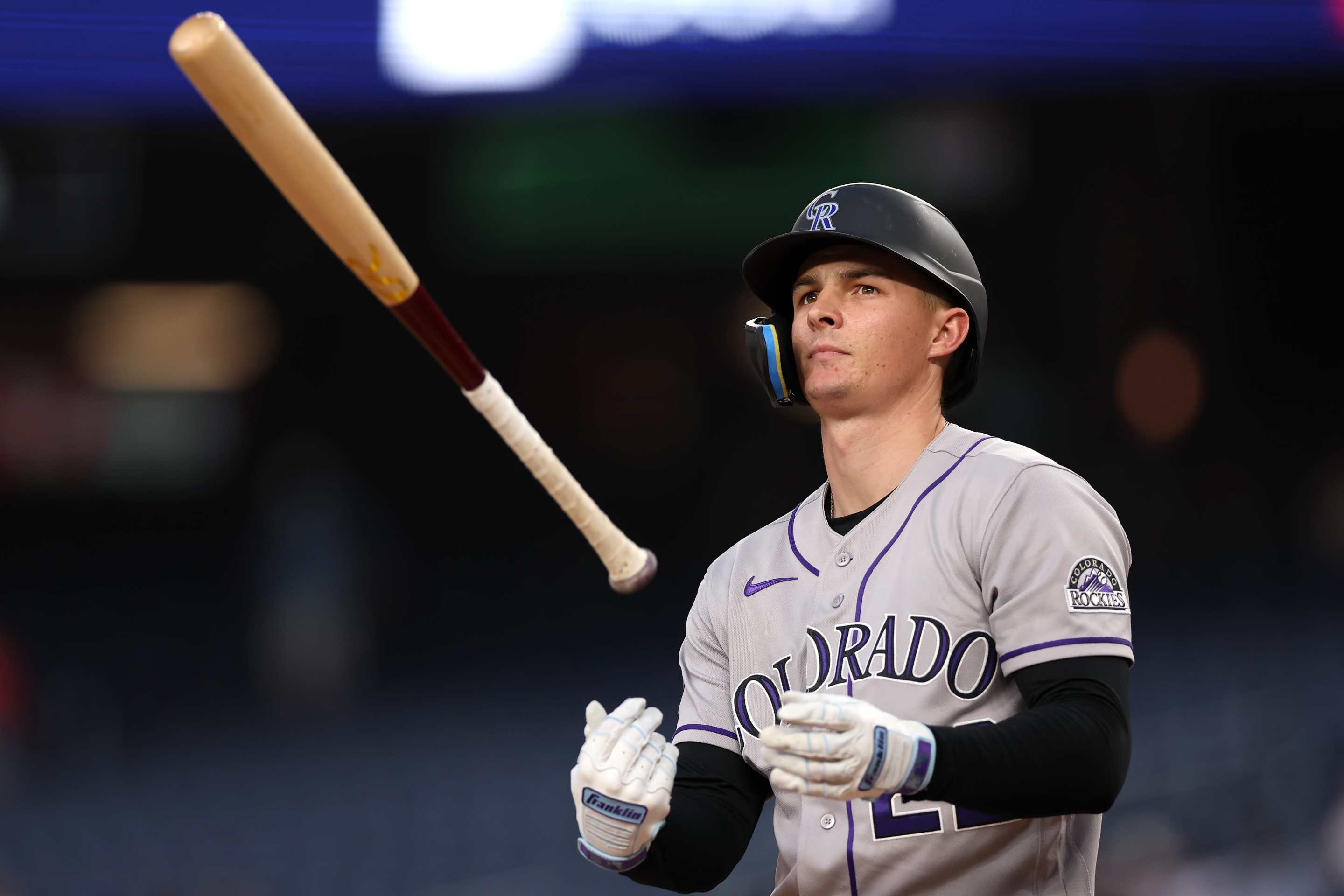 Mickey Moniak #22 of the Colorado Rockies reacts after striking out