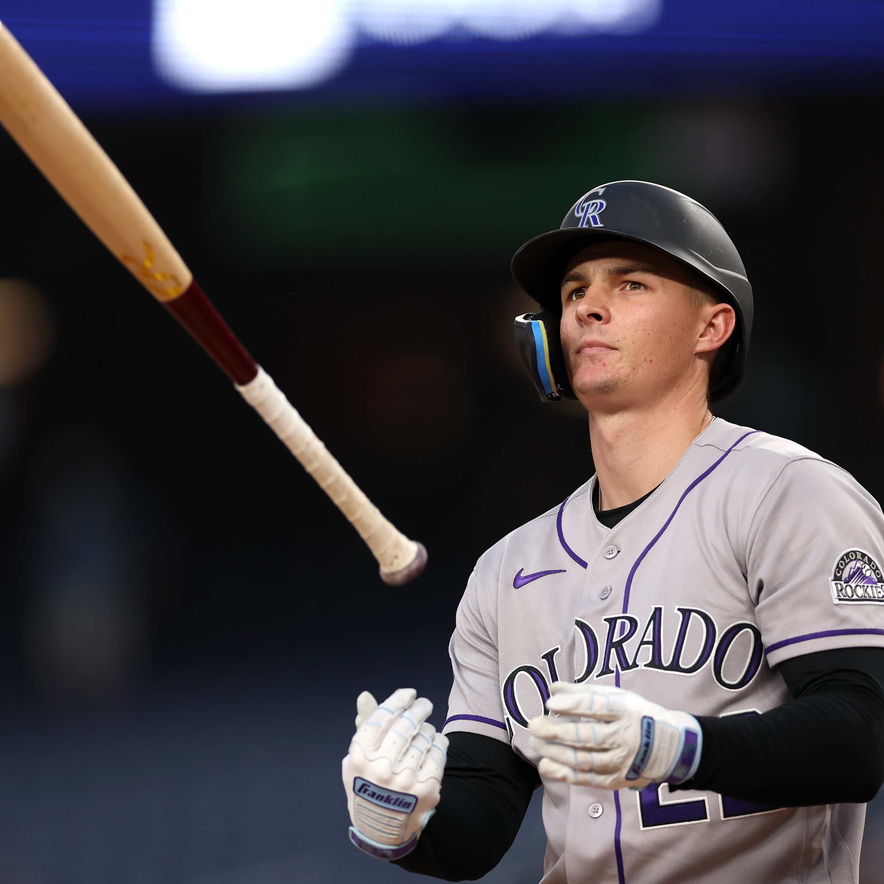 Mickey Moniak #22 of the Colorado Rockies reacts after striking out