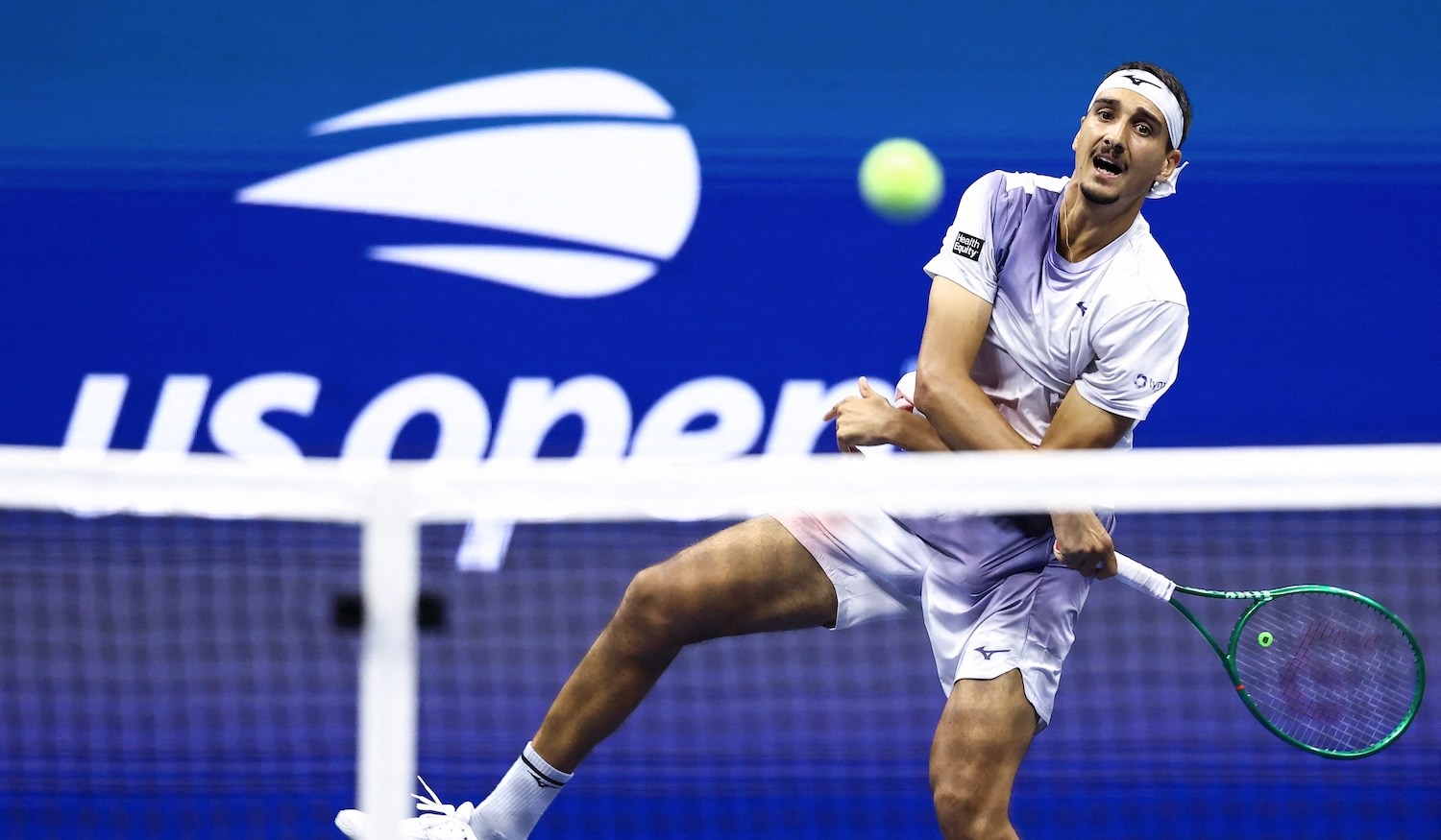 Italy's Lorenzo Sonego returns the ball to Germany's Alexander Zverev during the men's singles first round tennis match on day three of the US Open tennis tournament at the USTA Billie Jean King National Tennis Center in New York City on September 1, 2026. (Photo by CHARLY TRIBALLEAU / AFP)