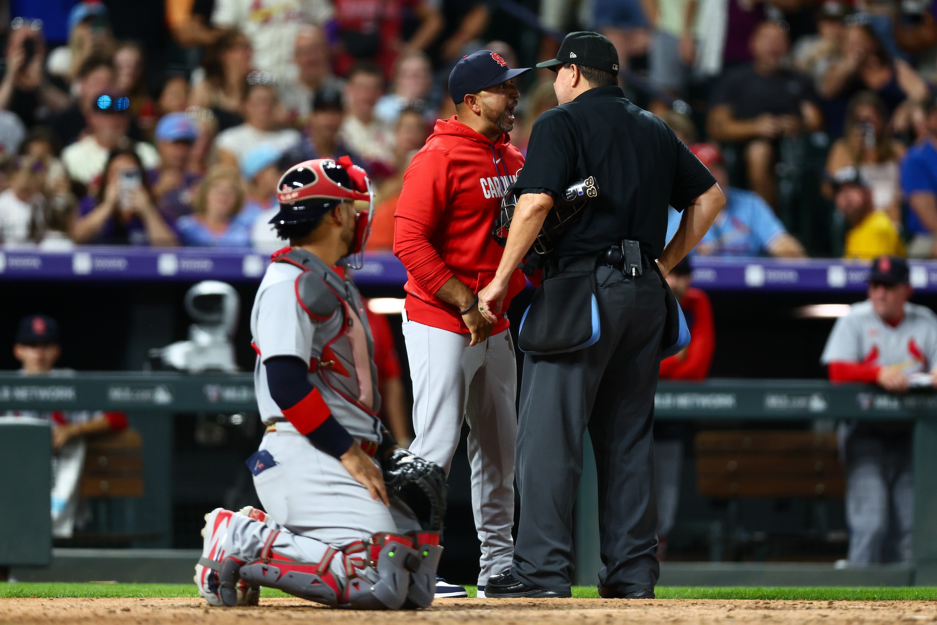 Manager Oliver Marmol of the St. Louis Cardinals (C) argues with umpire Doug Eddings #88 after getting ejected from the game on Friday, September 4, 2026.