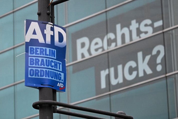 An election poster of the far-right Alternative for Germany (AfD) party reading "Berlin needs order" is fixed in front of the headquarters of Germany's conservative Christian Democratic Union (CDU) party, where the word "Rechtsruck?" (Shift to the right?) is displayed on the facade of the building in Berlin on September 7, 2026, one day after regional elections in the eastern federal state of Saxony-Anhalt. German Chancellor Friedrich Merz's CDU conservatives licked their wounds after a crushing state election defeat in the ex-communist east, as the triumphant far-right AfD launched a withering attack against him. Voters in the German capital will go to the polls in regional elections to take place on September 20, 2026. (Photo by RALF HIRSCHBERGER / AFP via Getty Images)
