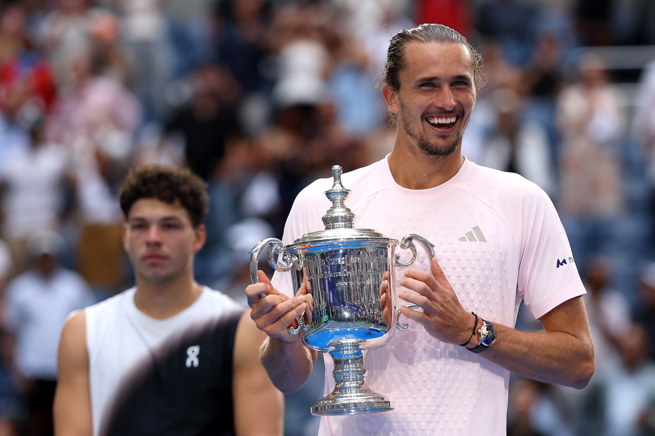 NEW YORK, NEW YORK - SEPTEMBER 13: Alexander Zverev of Germany celebrates with the trophy after defeating Ben Shelton of the United States in their Men's Singles Final match on Day Fifteen of the 2026 US Open at USTA Billie Jean King National Tennis Center on September 13, 2026 in the Flushing neighborhood of the Queens borough of New York City. (Photo by Matthew Stockman/Getty Images)
