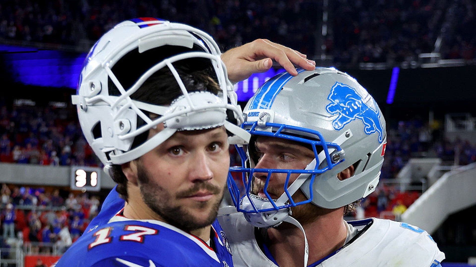 Josh Allen pats Aidan Hutchinson on the helmet after their game