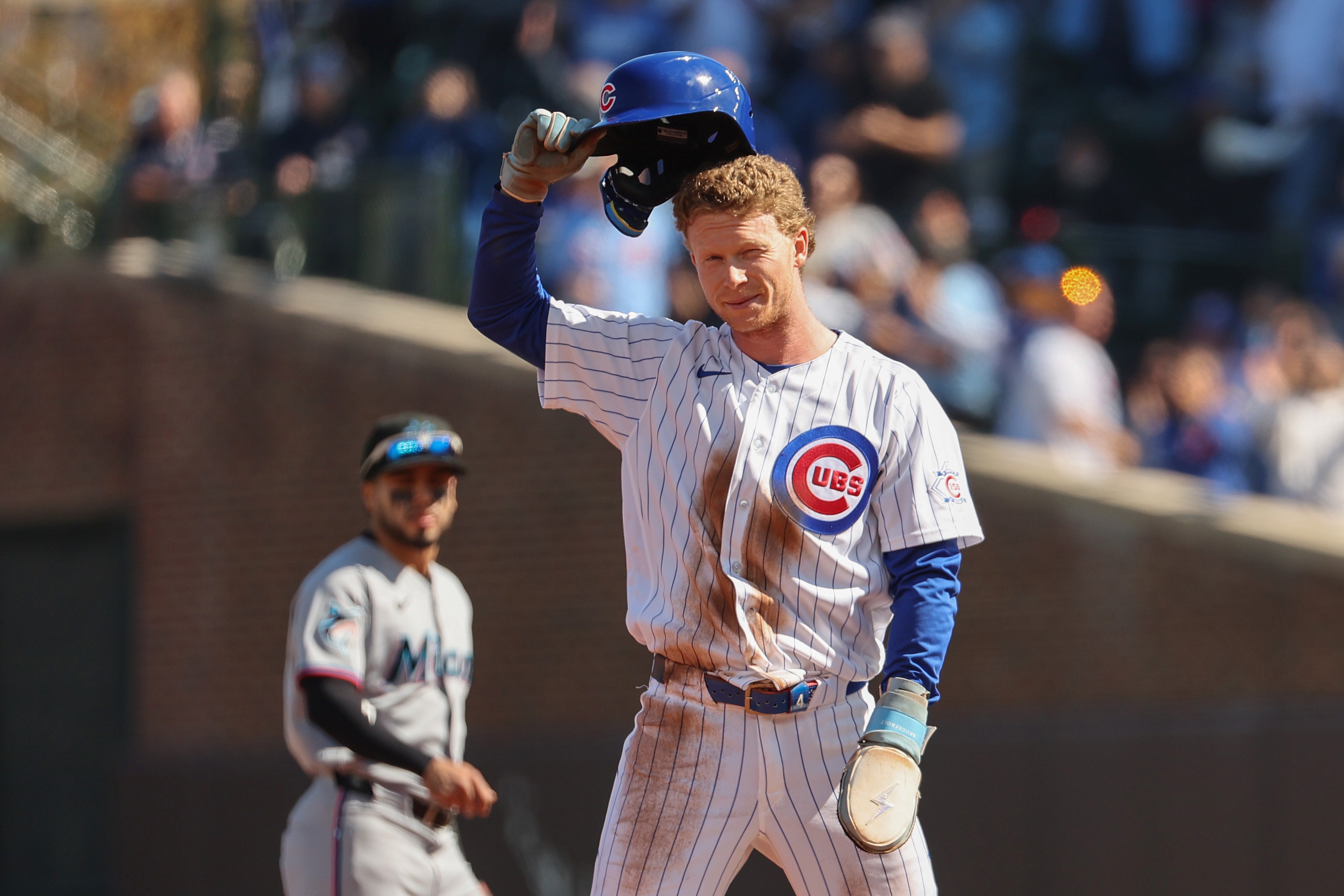 Pete Crow-Armstrong #4 of the Chicago Cubs tips his hat to the crowd after stealing his 40th stolen base during the first inning against the Miami Marlins at Wrigley Field on September 24, 2026.