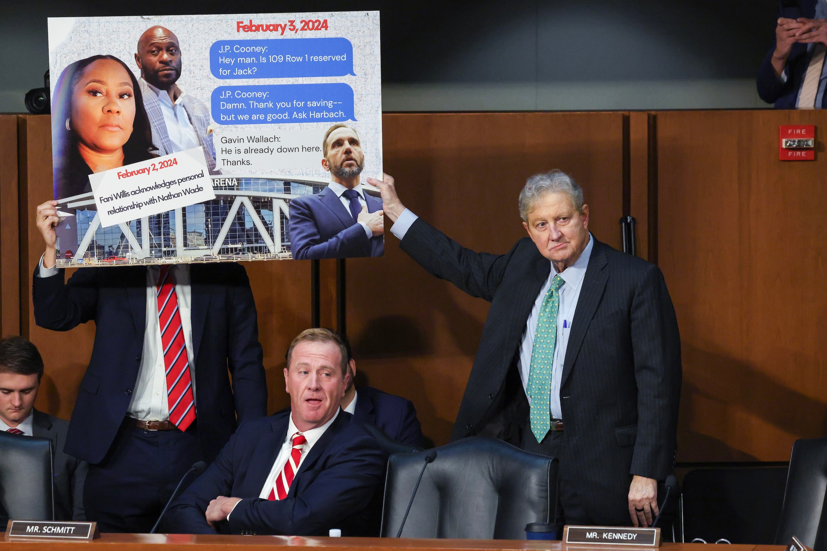 Senate Judiciary Committee member Sen. Eric Schmitt (R-MO) (L) and Sen. John Kennedy (R-LA) display a sign accusing former Special Counsel Jack Smith of meeting with Fulton County, Georgia, District Attorney Fani Willis during a hearing before the Senate Judiciary Committee in the Hart Senate Office Building on September 29, 2026. Everyone looks pretty pleased with themselves.