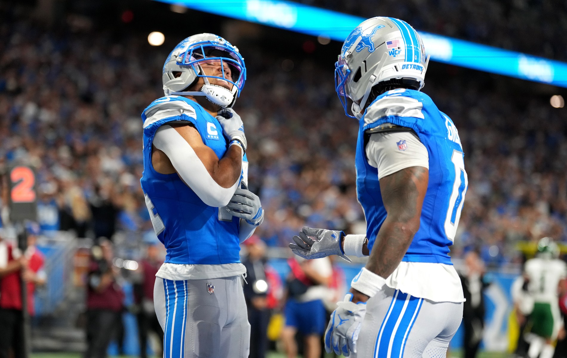 Amon-Ra St. Brown #14 of the Detroit Lions celebrates after scoring a touchdown with Jahmyr Gibbs #0 against the New York Jets during the second quarter on September 27, 2026.