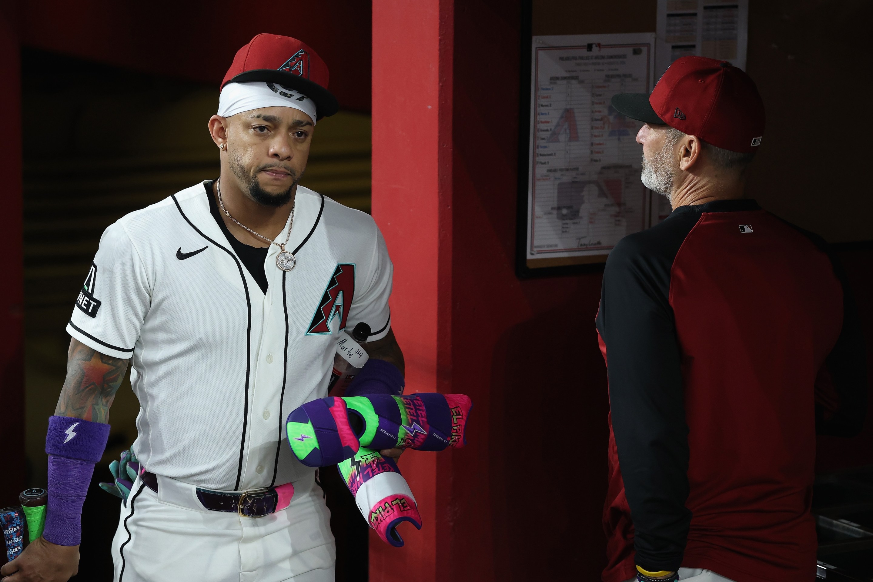 Ketel Marte #4 of the Arizona Diamondbacks walks into the dugout before the MLB game against the Philadelphia Phillies at Chase Field on August 31.