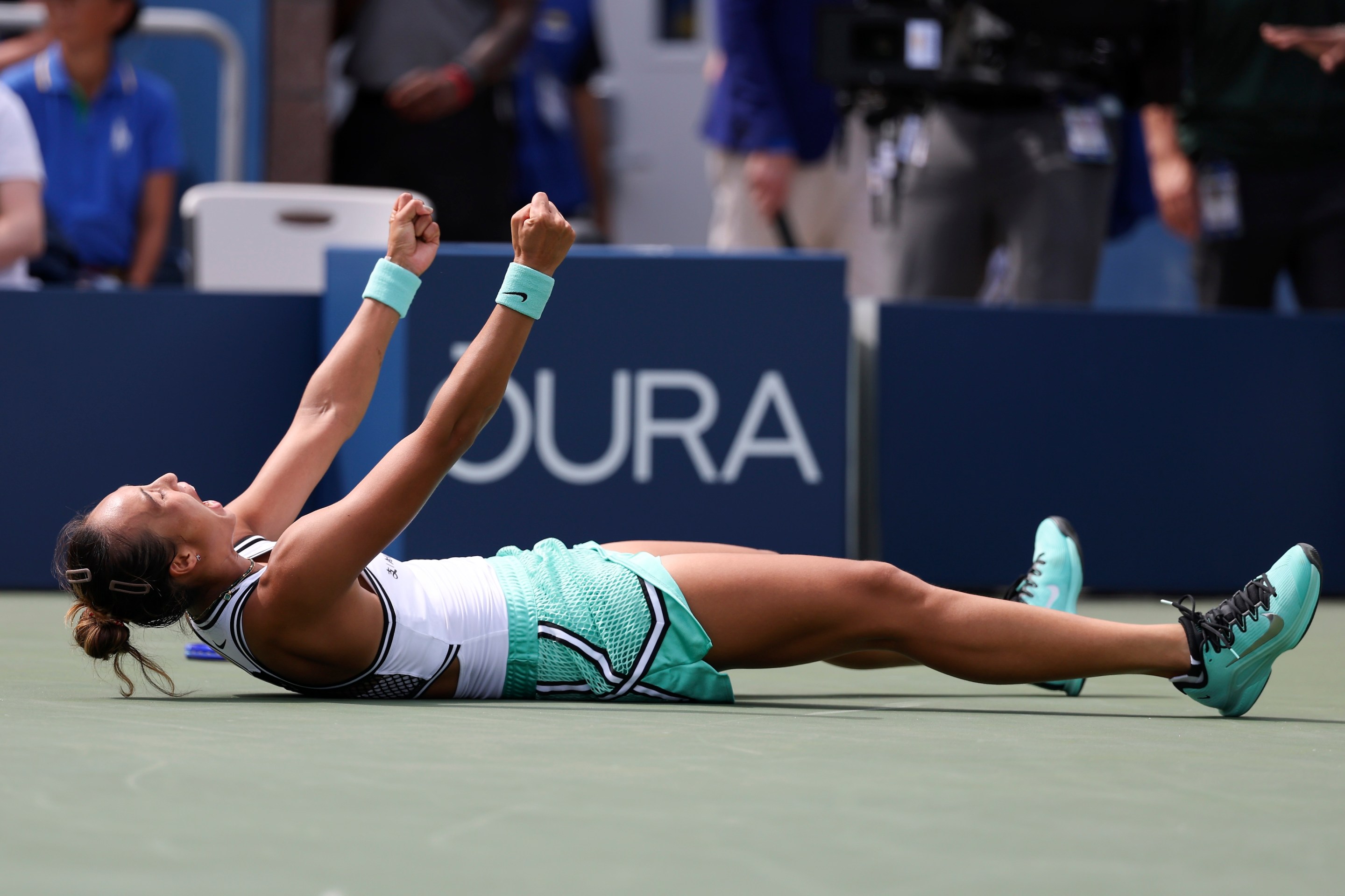 Qinwen Zheng of China celebrates after defeating Madison Keys of the United States.