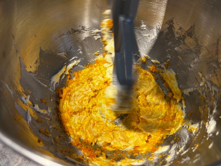 Butter, sugar, and orange zest, in a stand mixer.