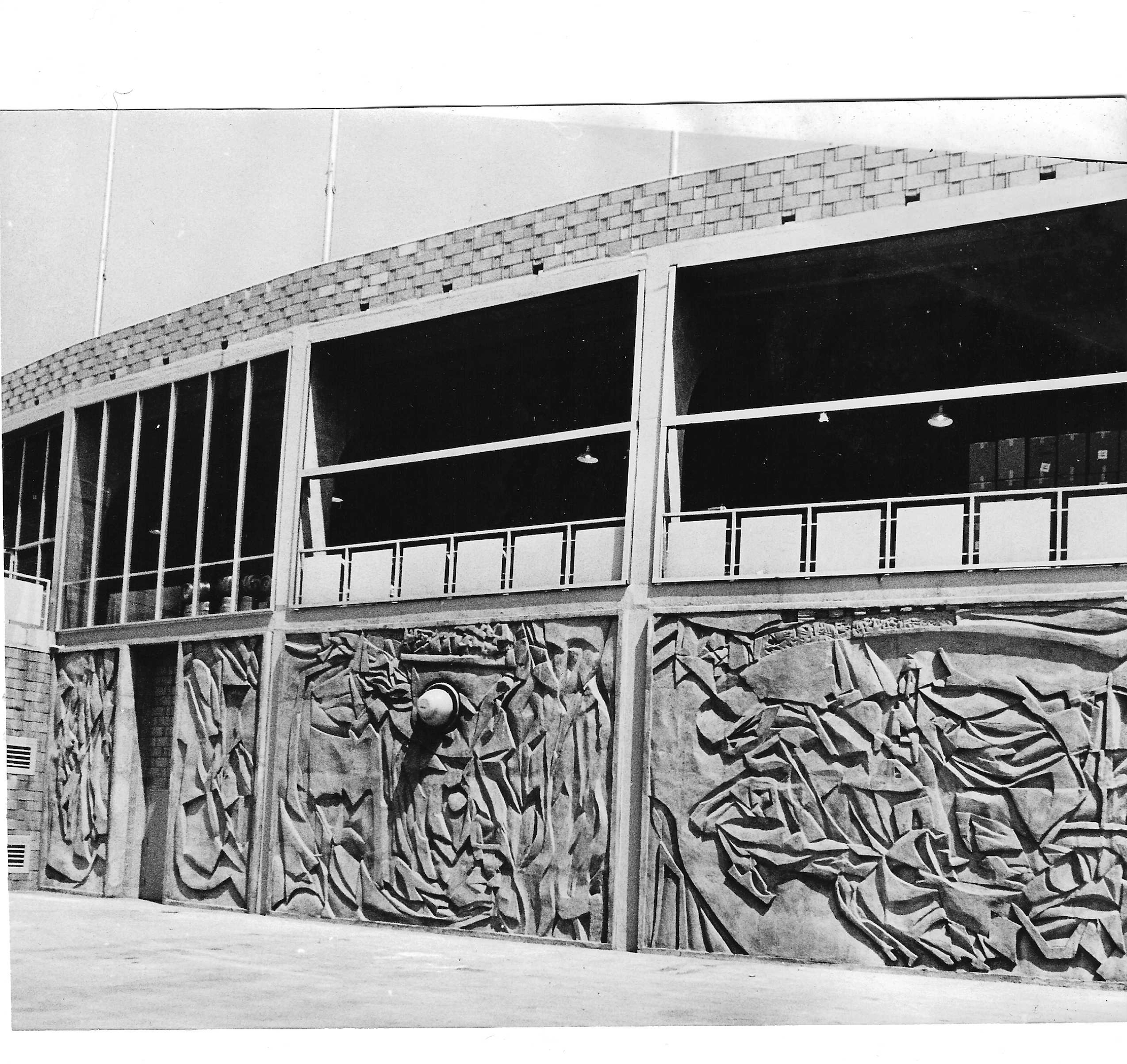 A black and white image of the concrete murals outside Dodger Stadium, taken in the 1960s.