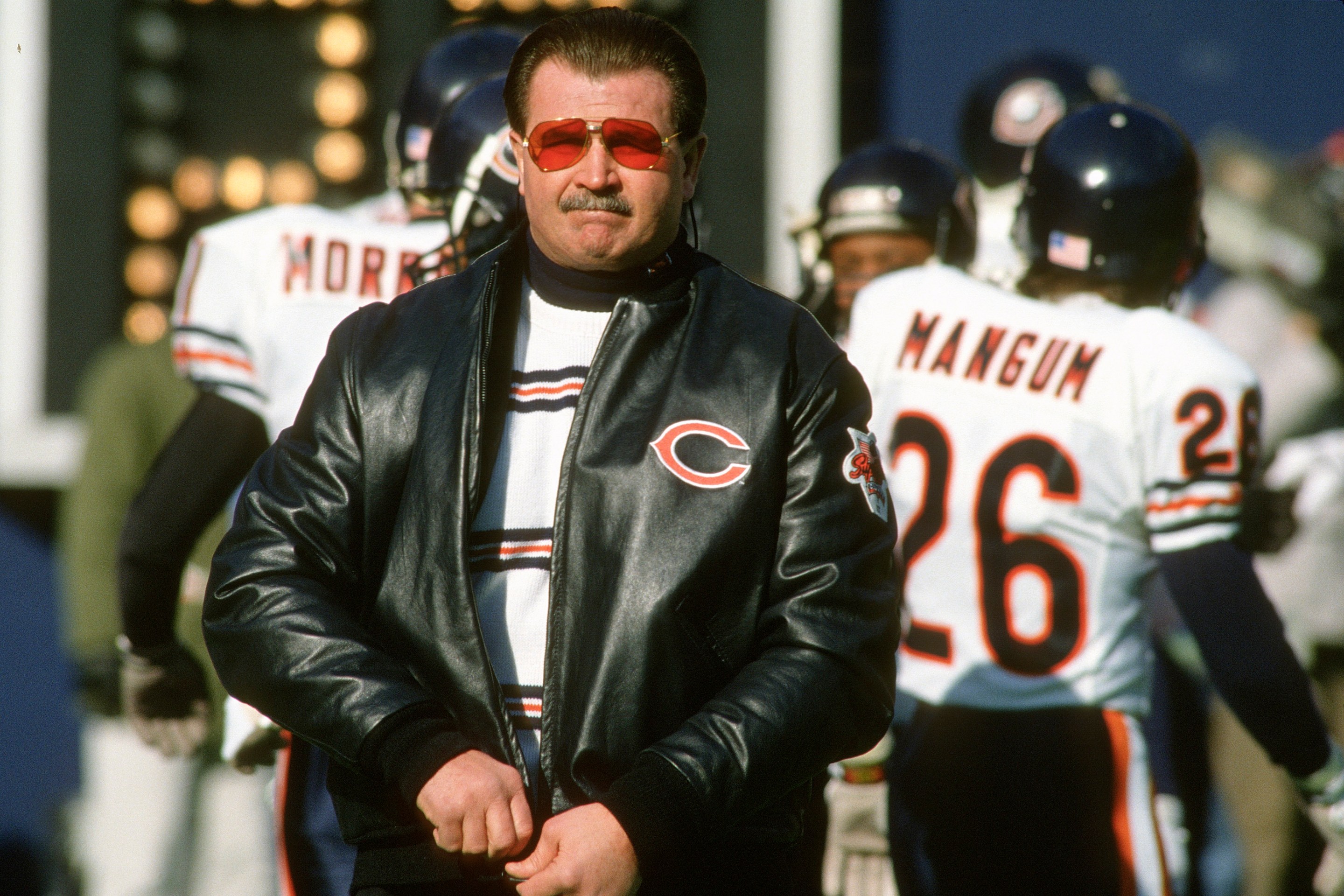 Head Coach Mike Ditka of the Chicago Bears looks on while his team warms up prior to playing the New York Giants in the NFC Divisional Playoff game January 13, 1991.