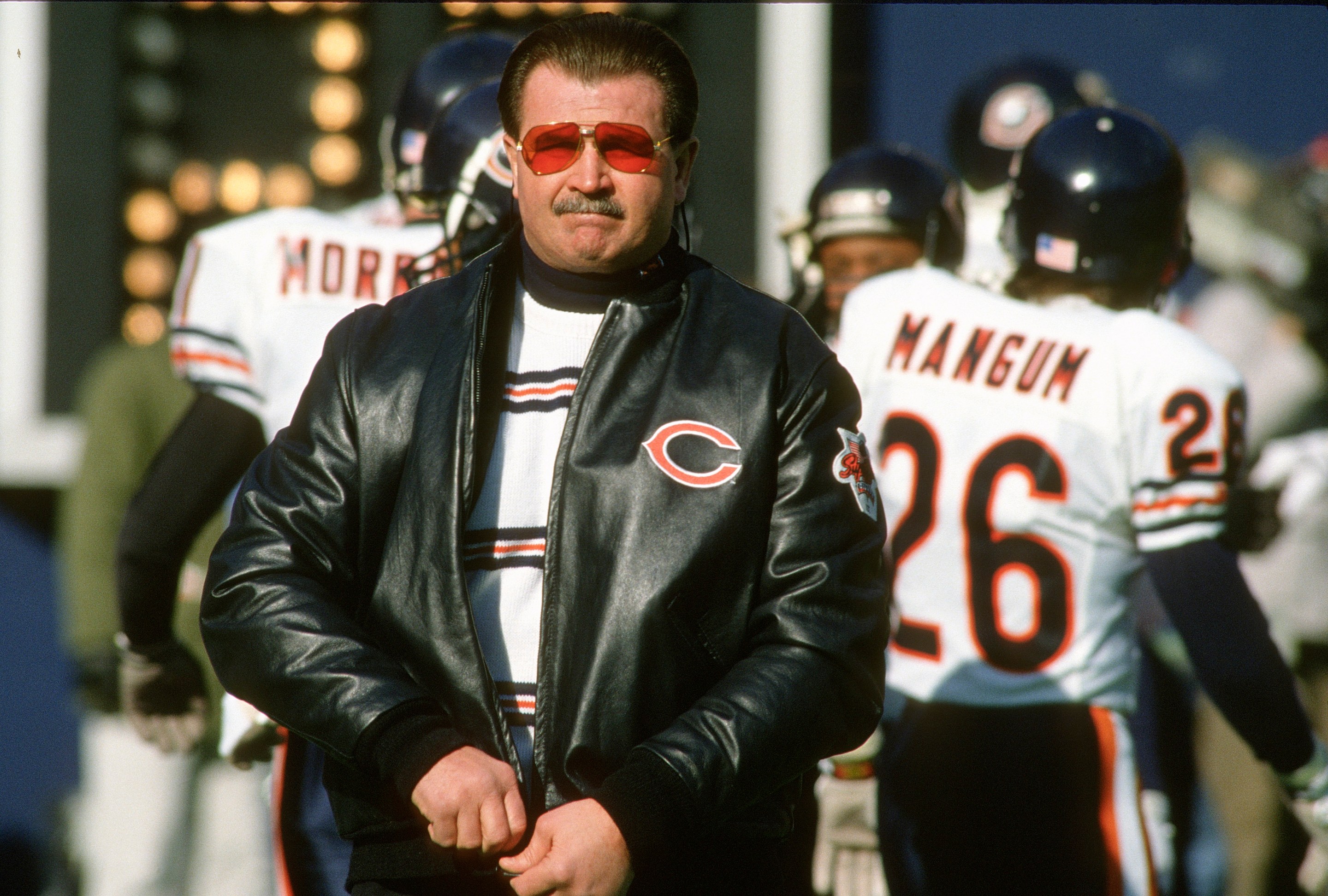 Head Coach Mike Ditka of the Chicago Bears looks on while his team warms up prior to playing the New York Giants in the NFC Divisional Playoff game January 13, 1991.