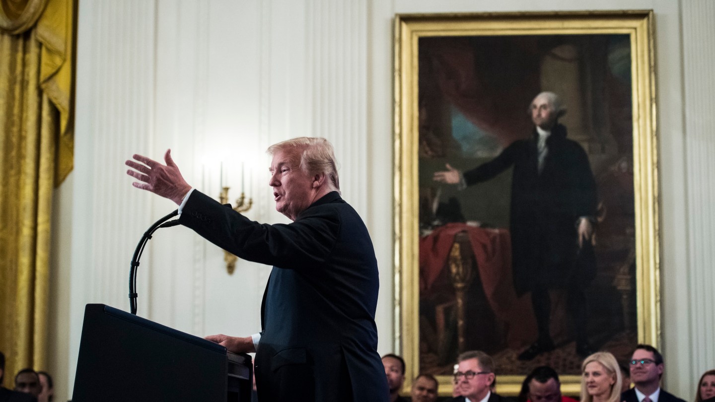 WASHINGTON, DC - JULY 19 : President Donald J. Trump gestures as he speaks in front of a painting of George Washington during a "Pledge to Americas Workers" event in the East Room of the White House on Thursday, July 19, 2018 in Washington, DC. (Photo by Jabin Botsford/The Washington Post via Getty Images)