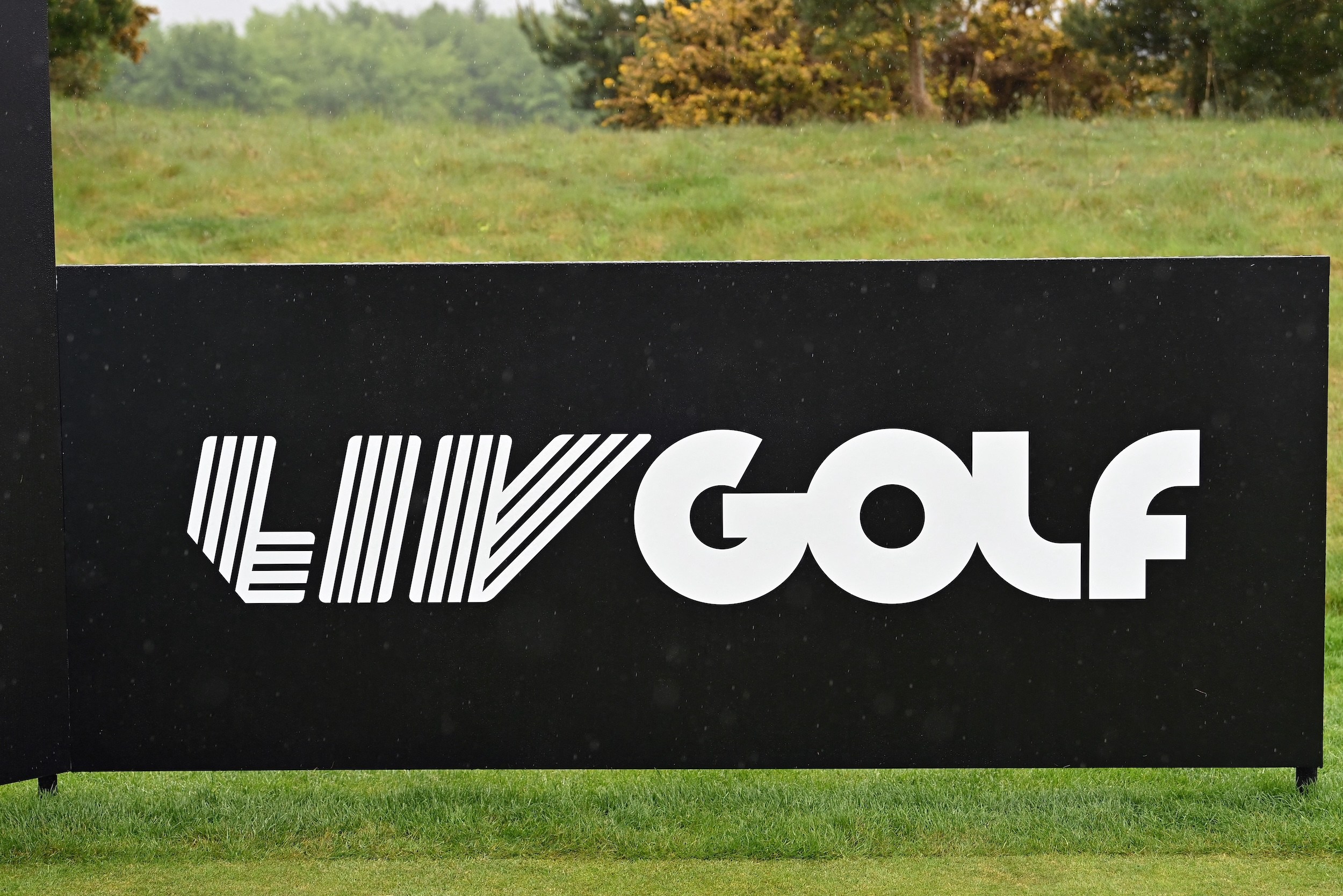 A low black sign for LIV Golf.