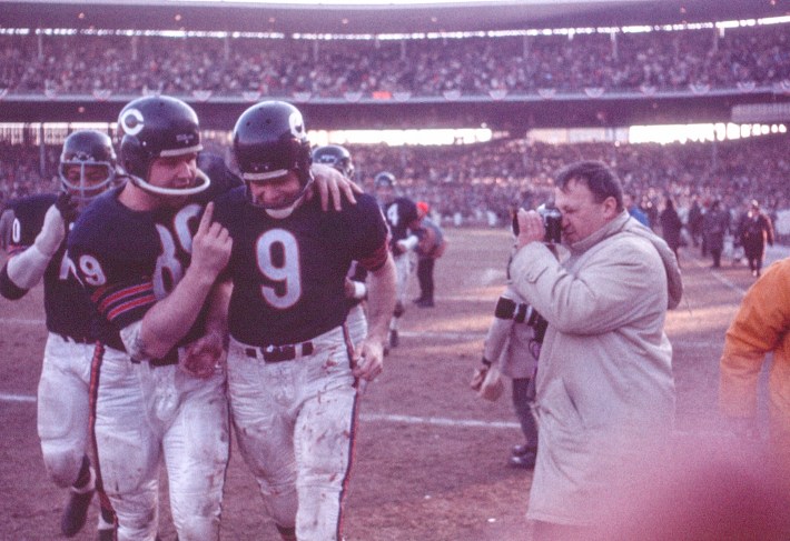 Chicago Bears tight end Mike Ditka (#89) congratulates quarterback Billy Wade (#9) as they walk off the field in victory after the 1963 NFL Championship Game against the New York Giants on December 29, 1963 at Wrigley Field in Chicago, Illinois.