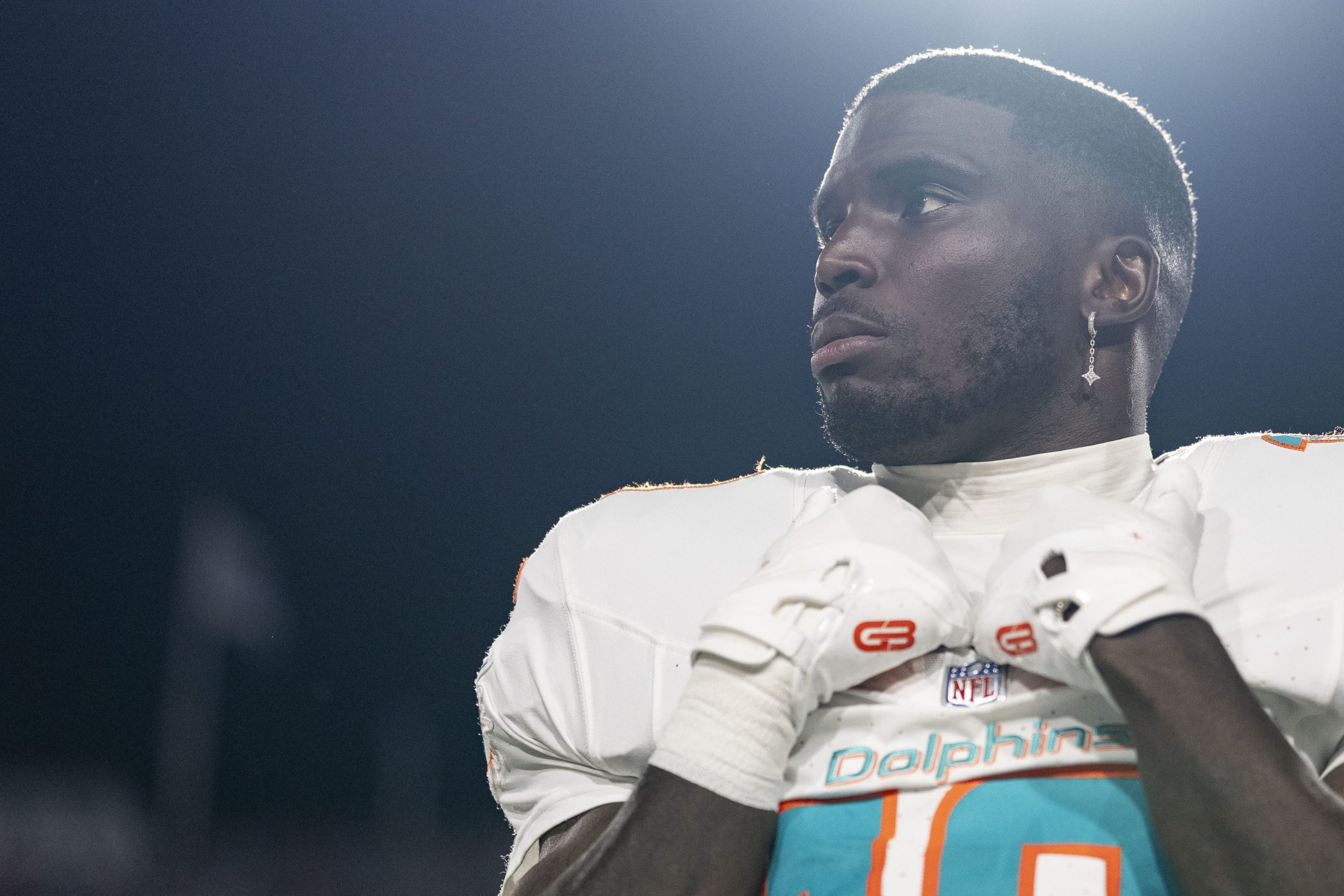 Tyreek Hill #10 of the Miami Dolphins looks on during the national anthem prior to an NFL football game against the Buffalo Bills at Highmark Stadium on September 18, 2025 in Orchard Park, New York.