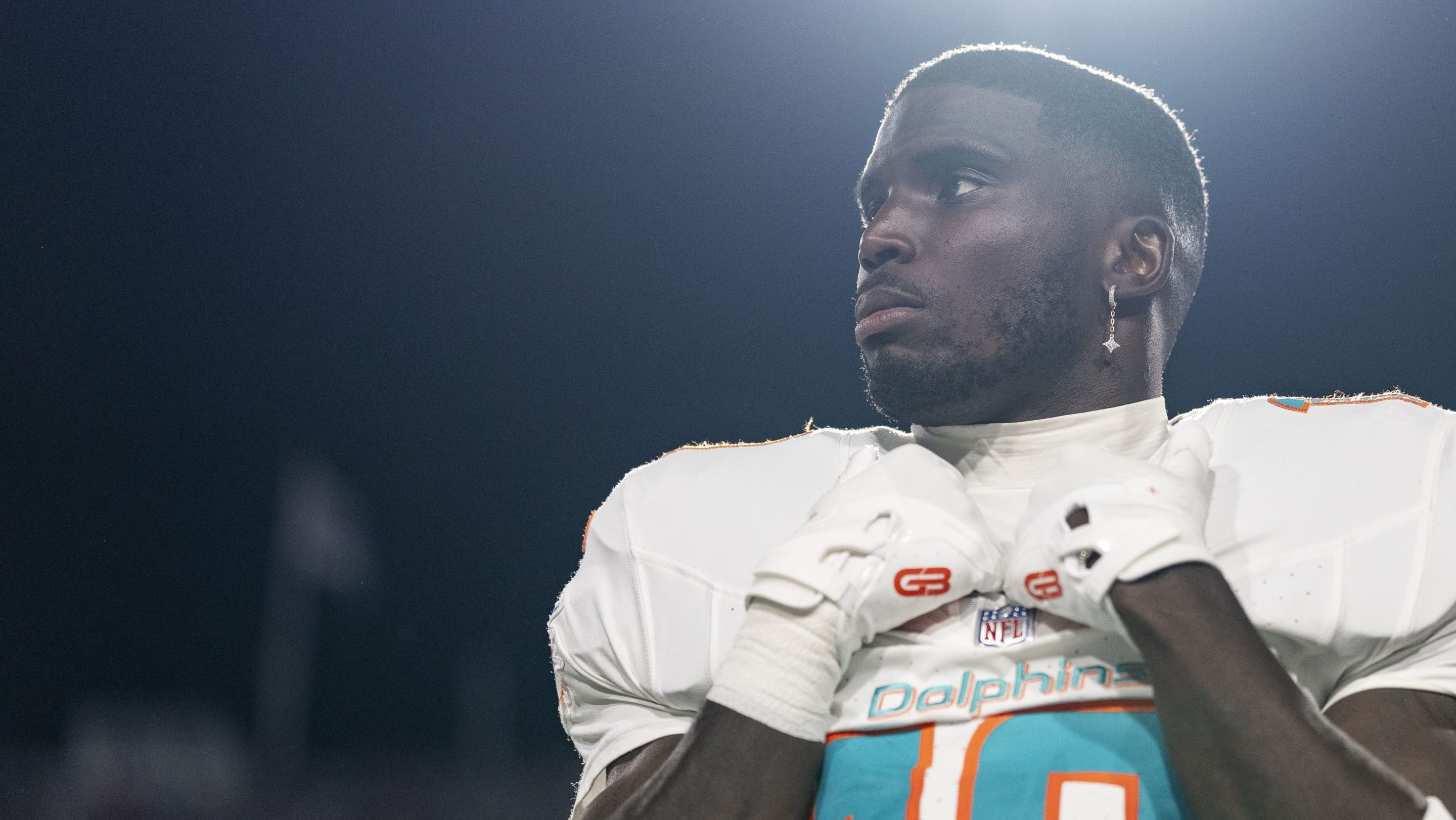Tyreek Hill #10 of the Miami Dolphins looks on during the national anthem prior to an NFL football game against the Buffalo Bills at Highmark Stadium on September 18, 2025 in Orchard Park, New York.