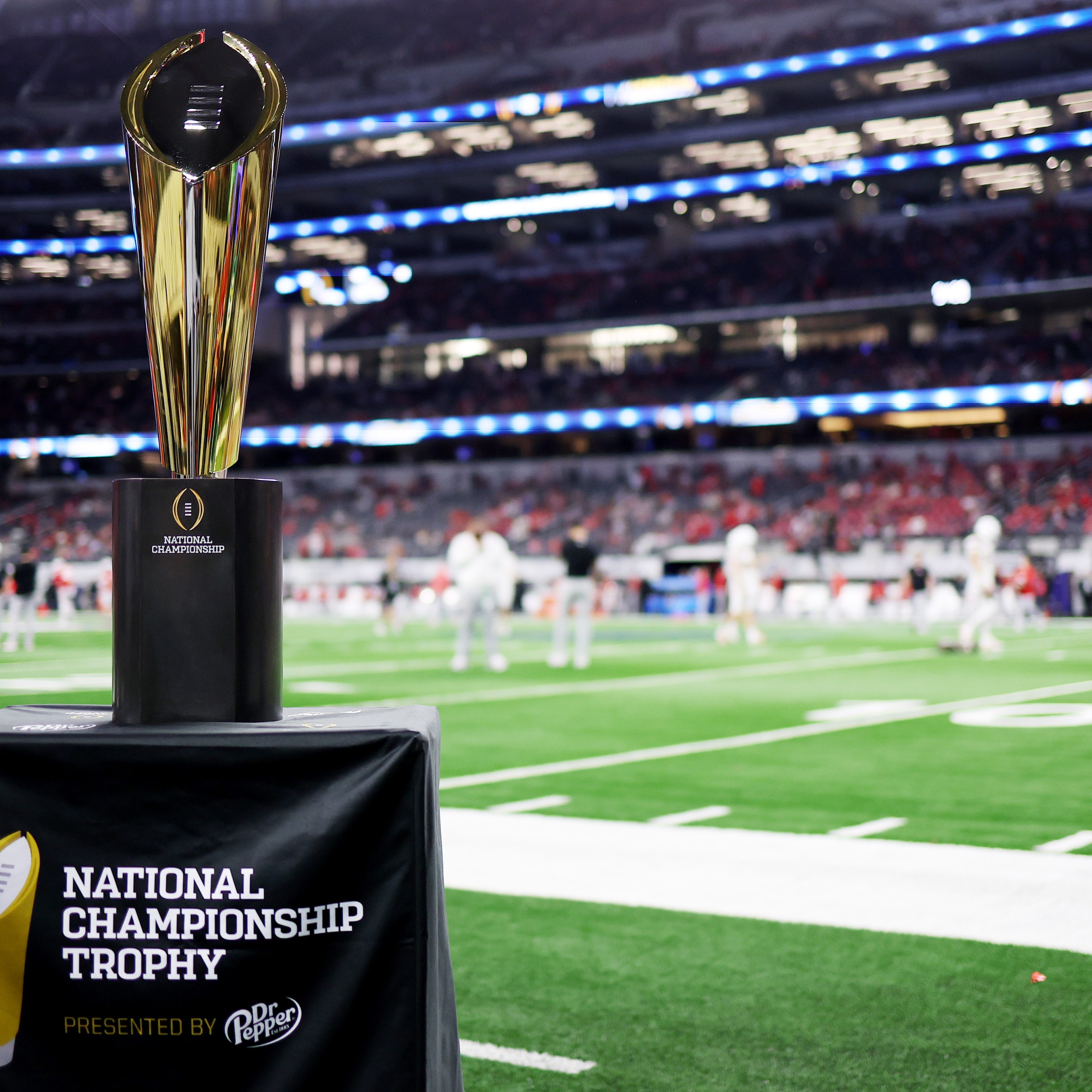 ARLINGTON, TEXAS - DECEMBER 31: A detailed view of the National Championship trophy prior to a game between the Miami Hurricanes and the Ohio State Buckeyes during the 2025 College Football Playoff Quarterfinal at the 90th Goodyear Cotton Bowl Classic at AT&amp;T Stadium on December 31, 2025 in Arlington, Texas.